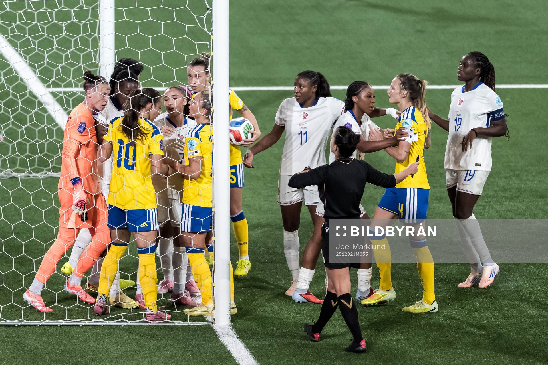 Goalkeeper Pauline Peyraud-Magnin of France argues with