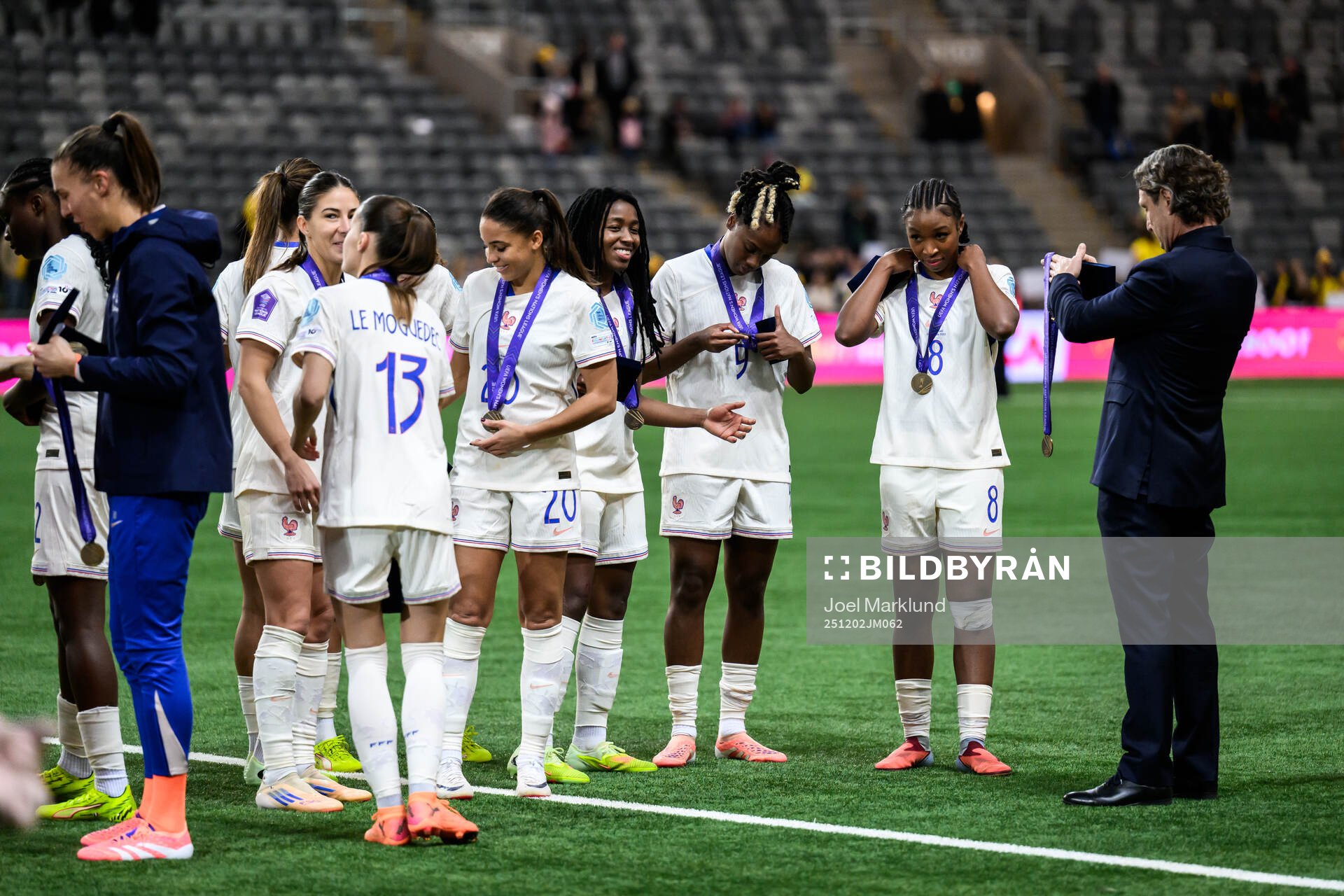 Players of France celebrate with their bronze medals