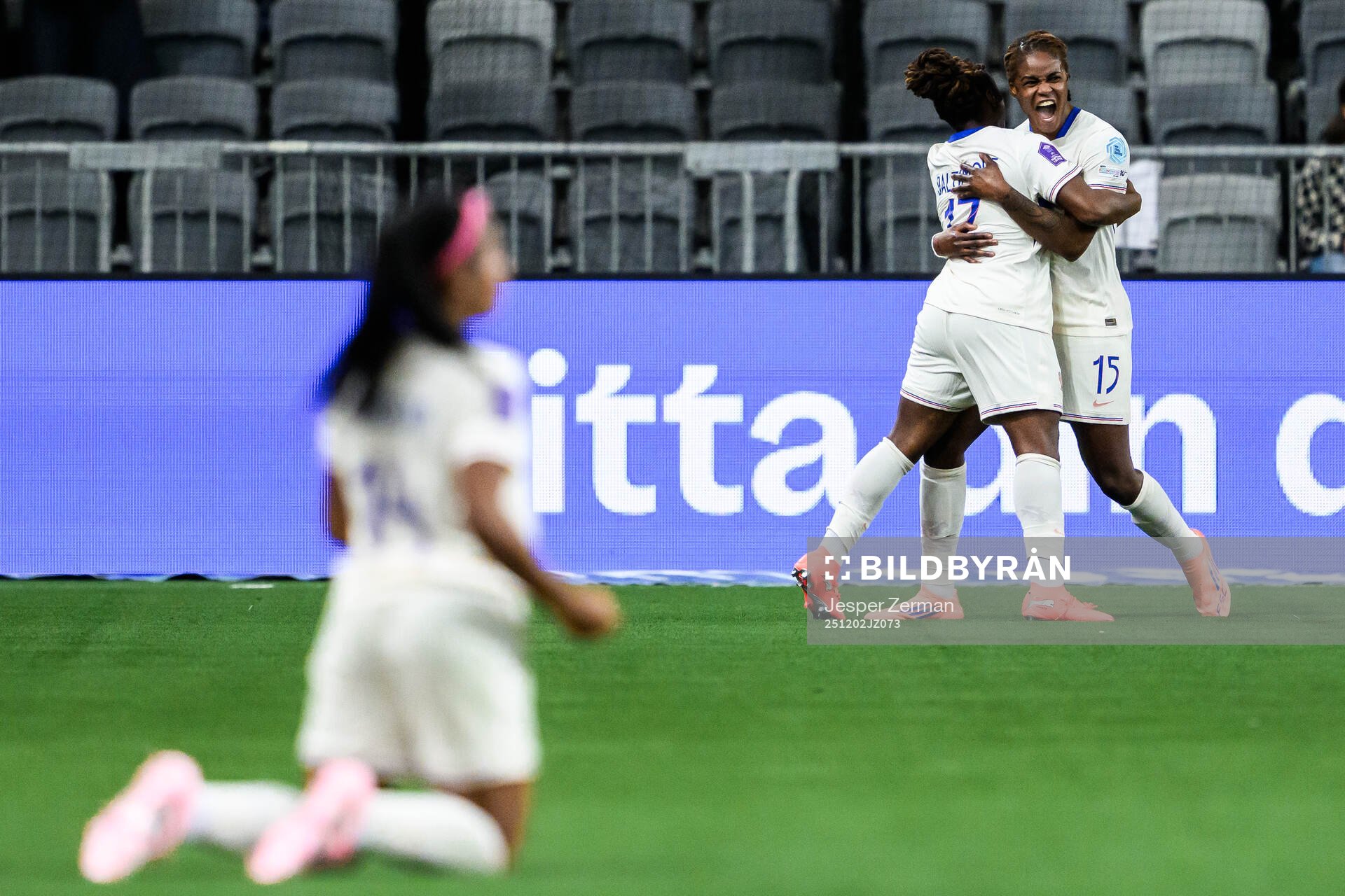 Kelly Gago and Sandy Baltimore of France celebrate