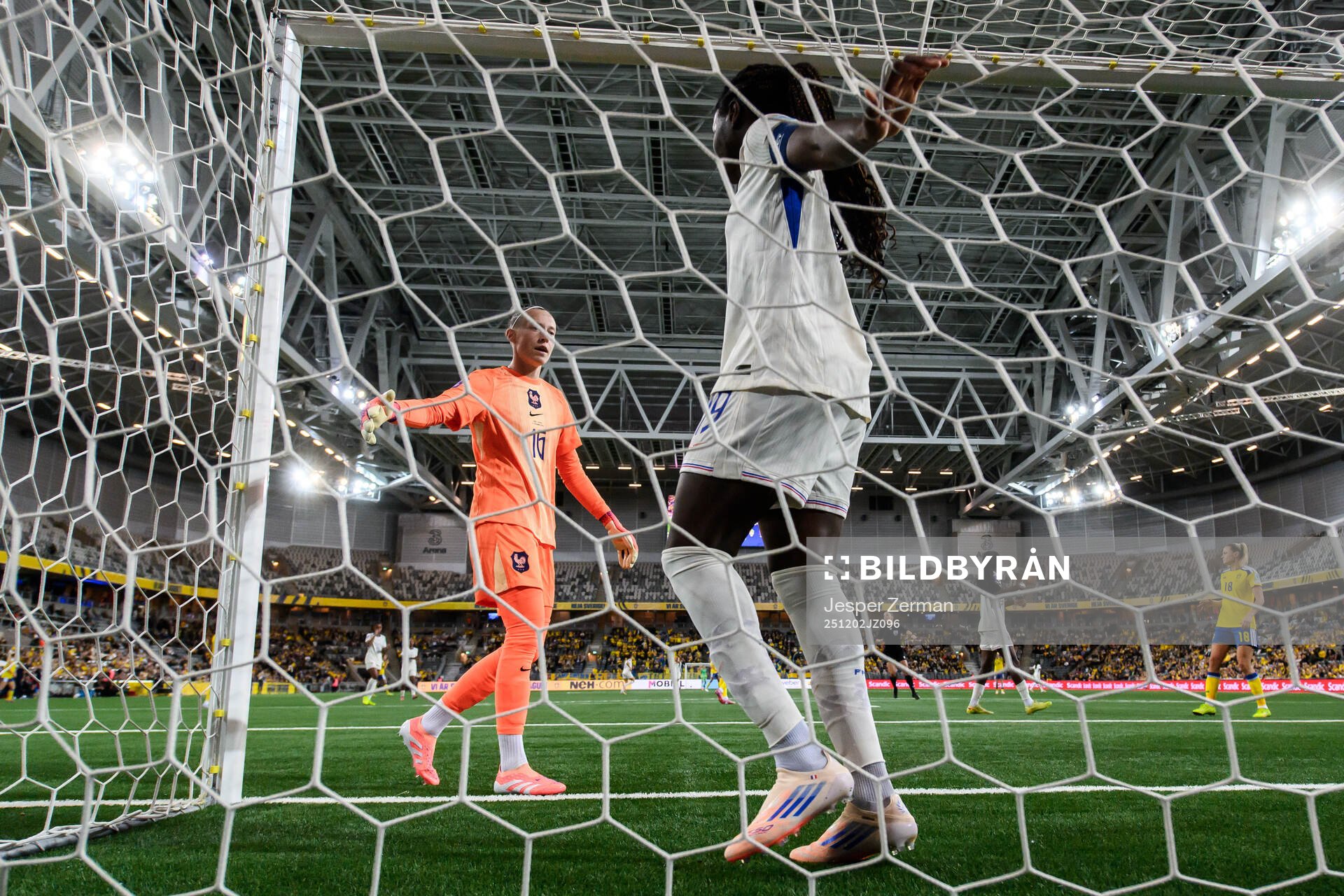 goalkeeper Pauline Peyraud-Magnin and Griedge Mbock Bathy