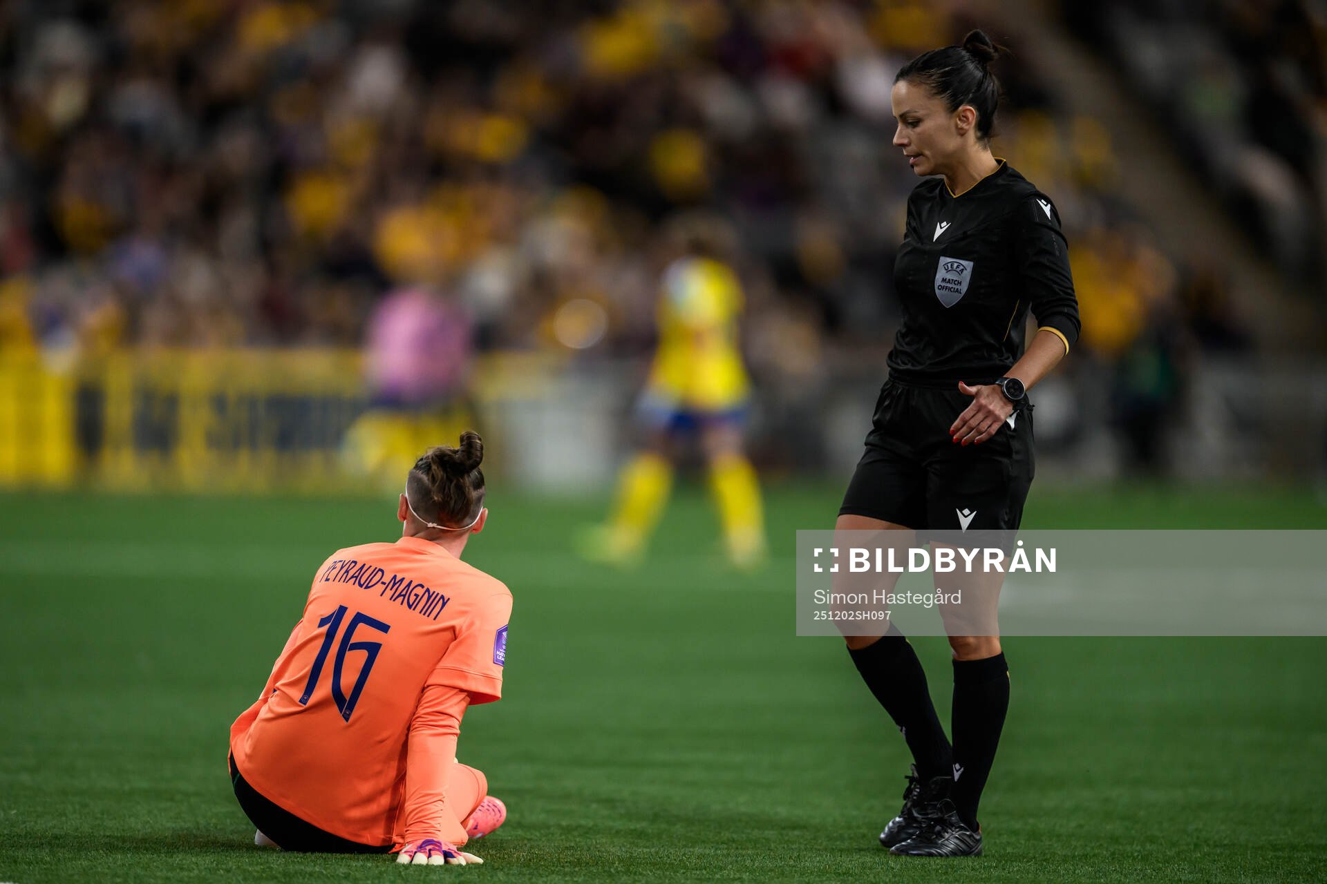 Goalkeeper Pauline Peyraud-Magnin of France and Referee