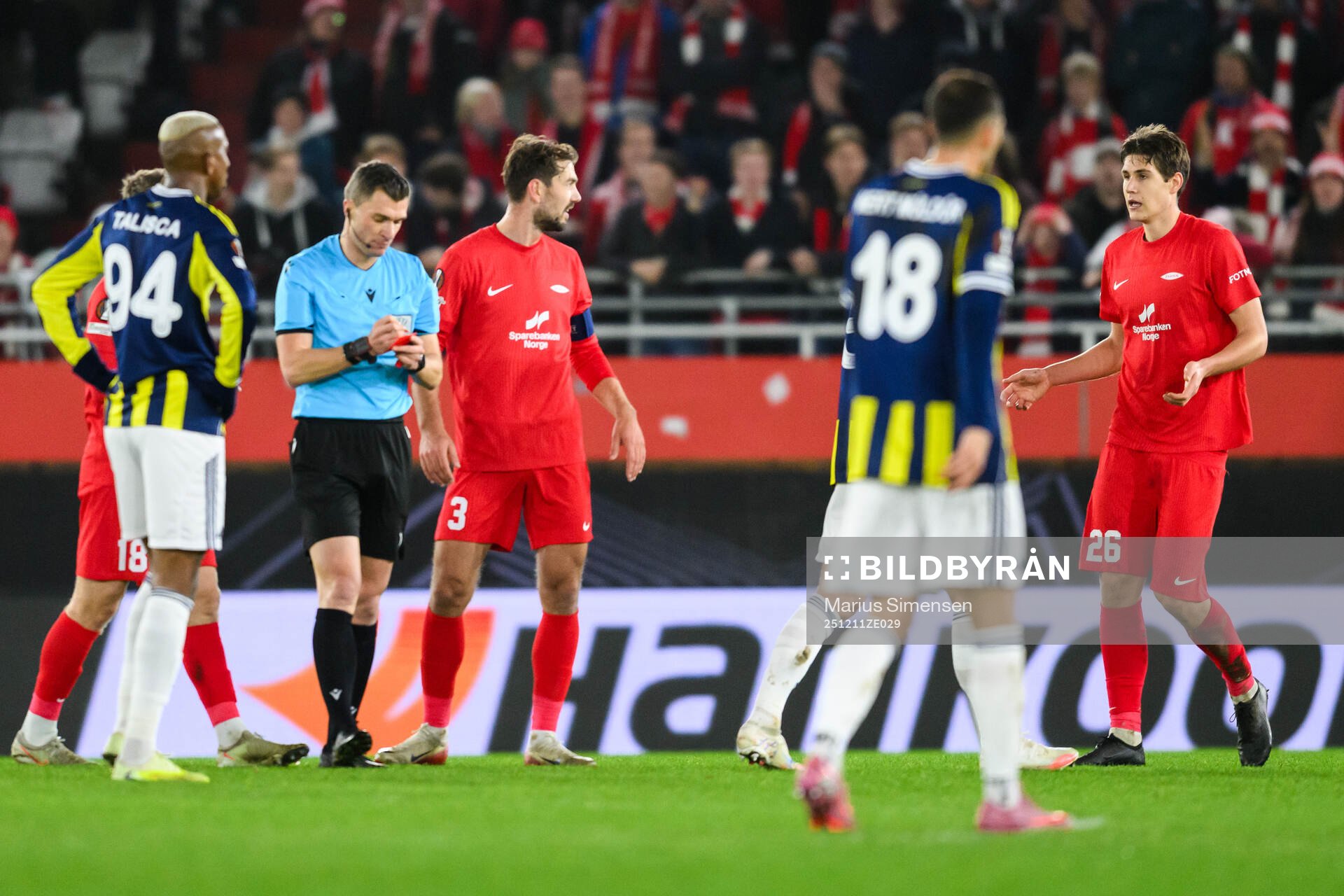 Referee Willy Delajod and Eivind Helland of Brann