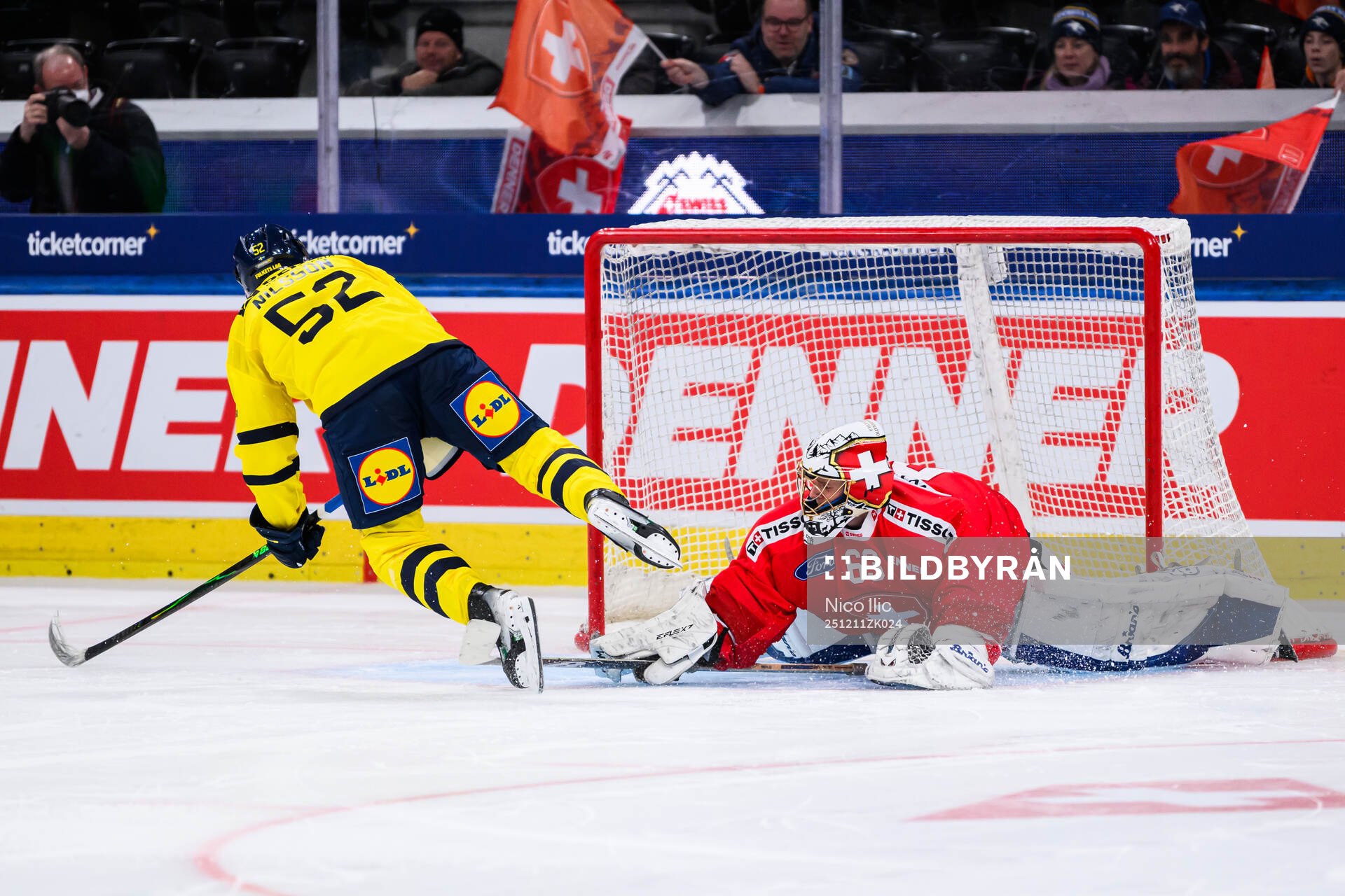 Felix Nilsson of Sweden scores the game winning goal behind