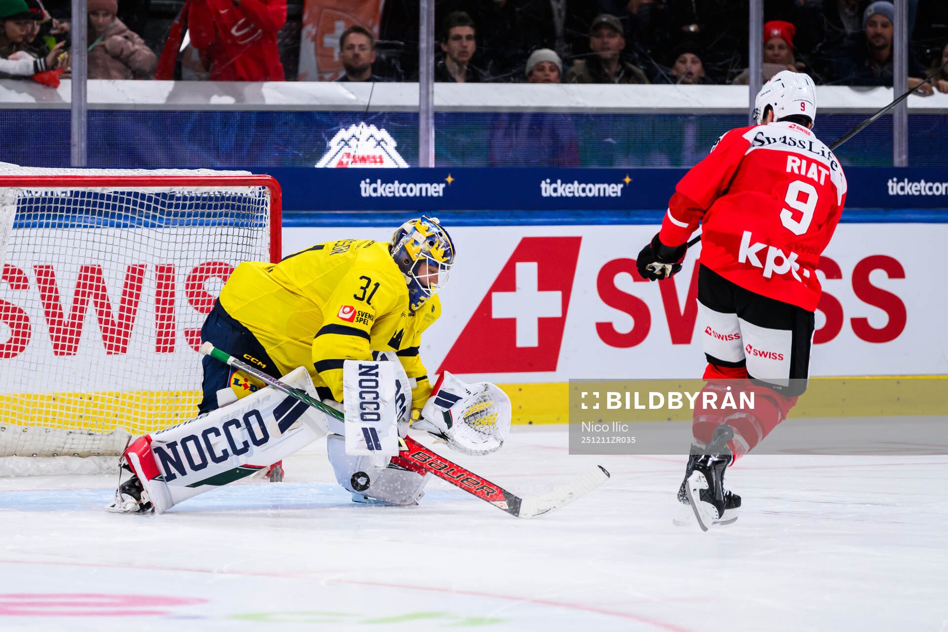 Goalkeeper Lars Johansson of Sweden and Damien Riat  of