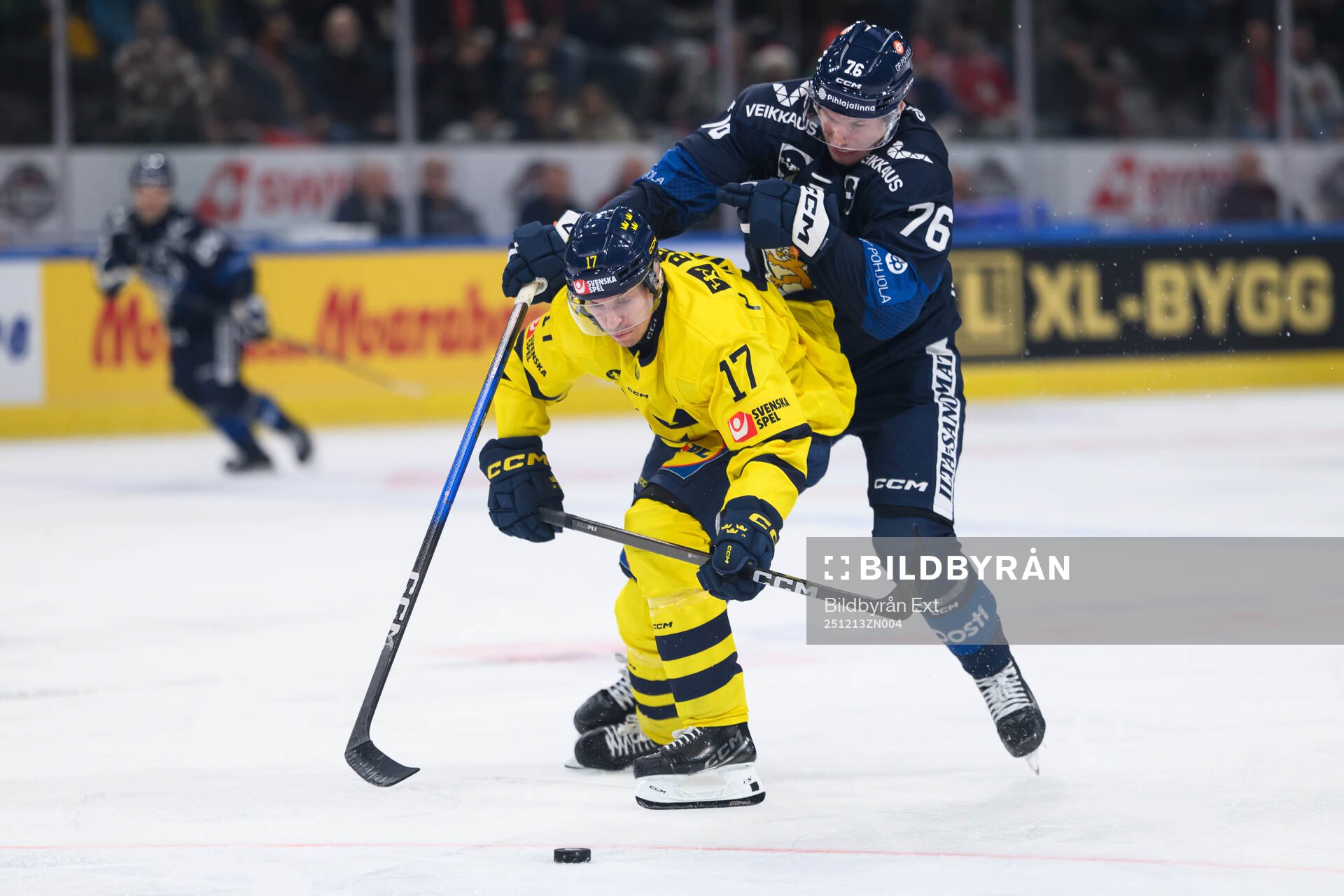 Pär Lindholm and Jere Sallinen of Finland in the ice