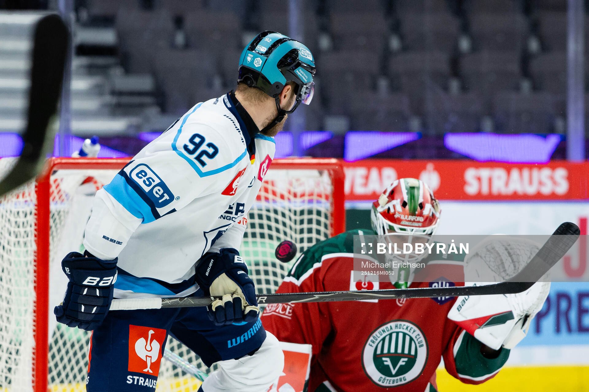 Daniel Schmölz of Ingolstadt and goaltender Lars Johansson