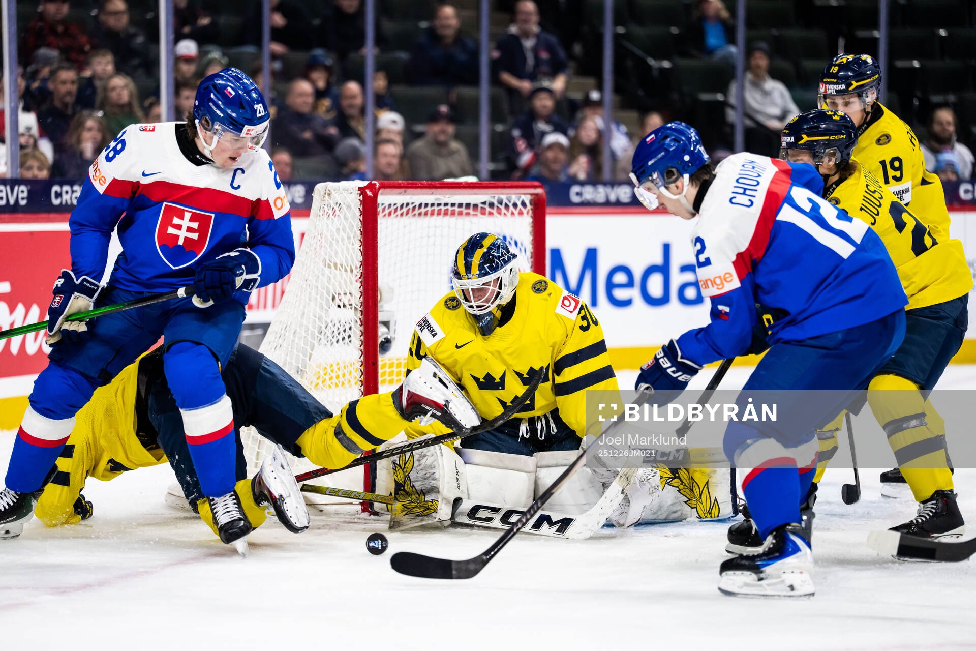 Tobias Pitka and Jan Chovan of Slovakia against goaltender