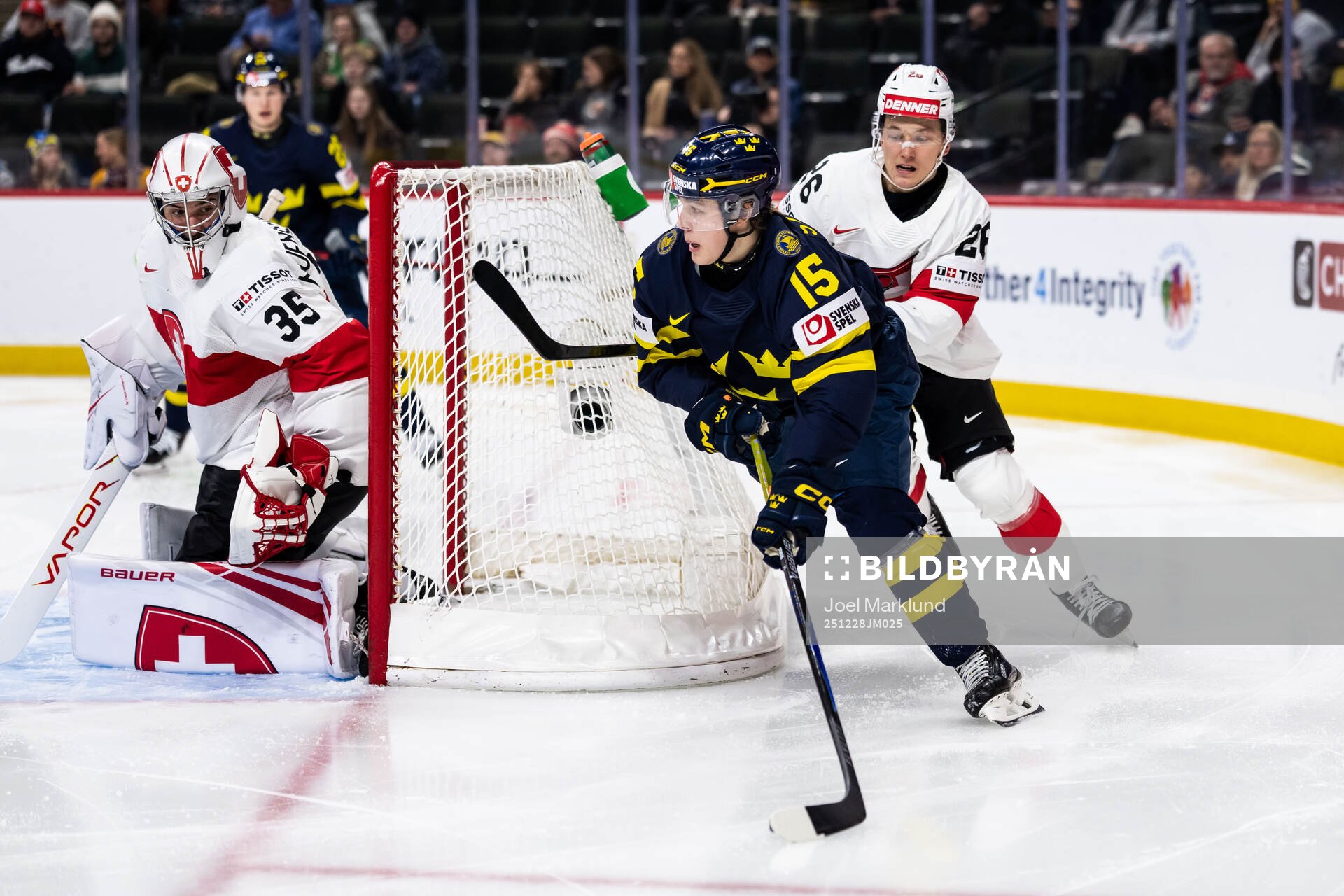 goaltender Elijah Neuenschwander and Ludvig Johnson of
