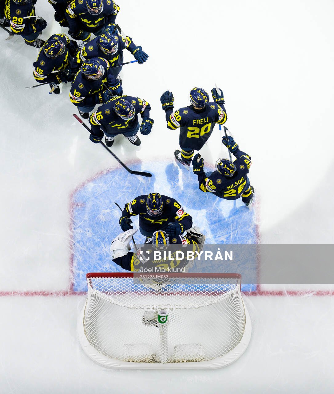 Players of Sweden celebrate together with goaltender Love