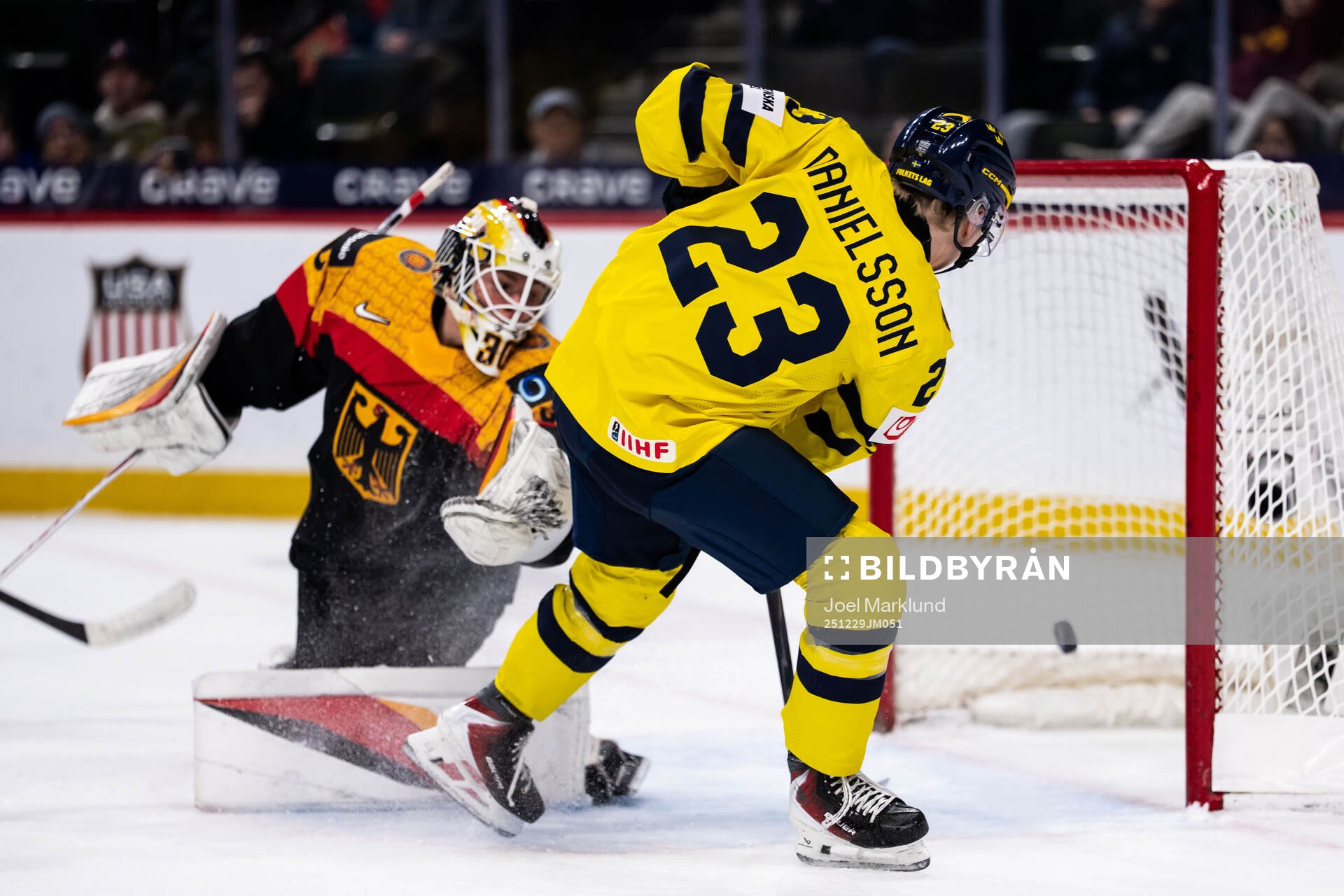 Liam Danielsson of Sweden scores 1-7 behind goaltender