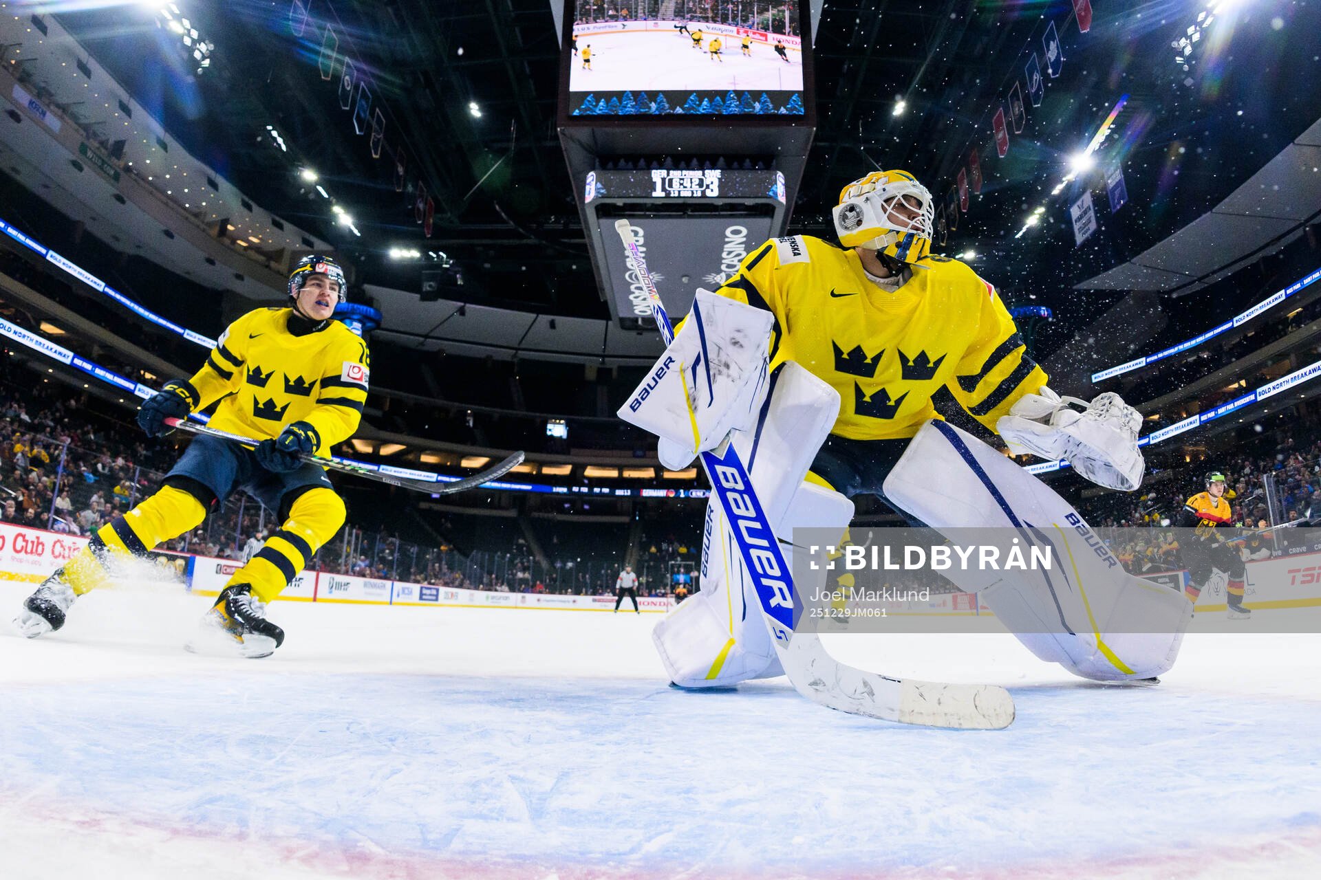 Anton Frondell and goaltender Herman Liv of Sweden
