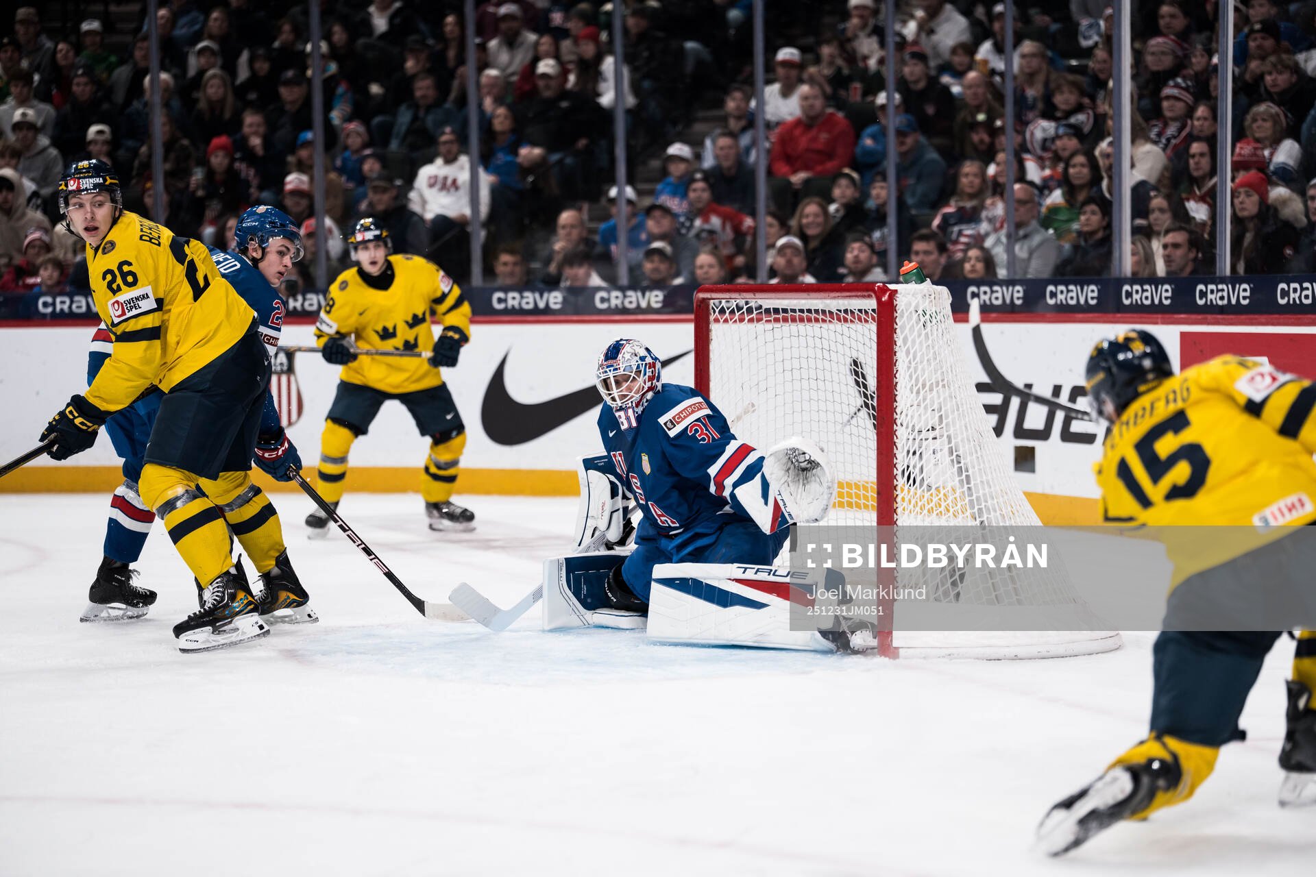 Jack Berglund of Sweden and goaltender Nicholas Kempf of
