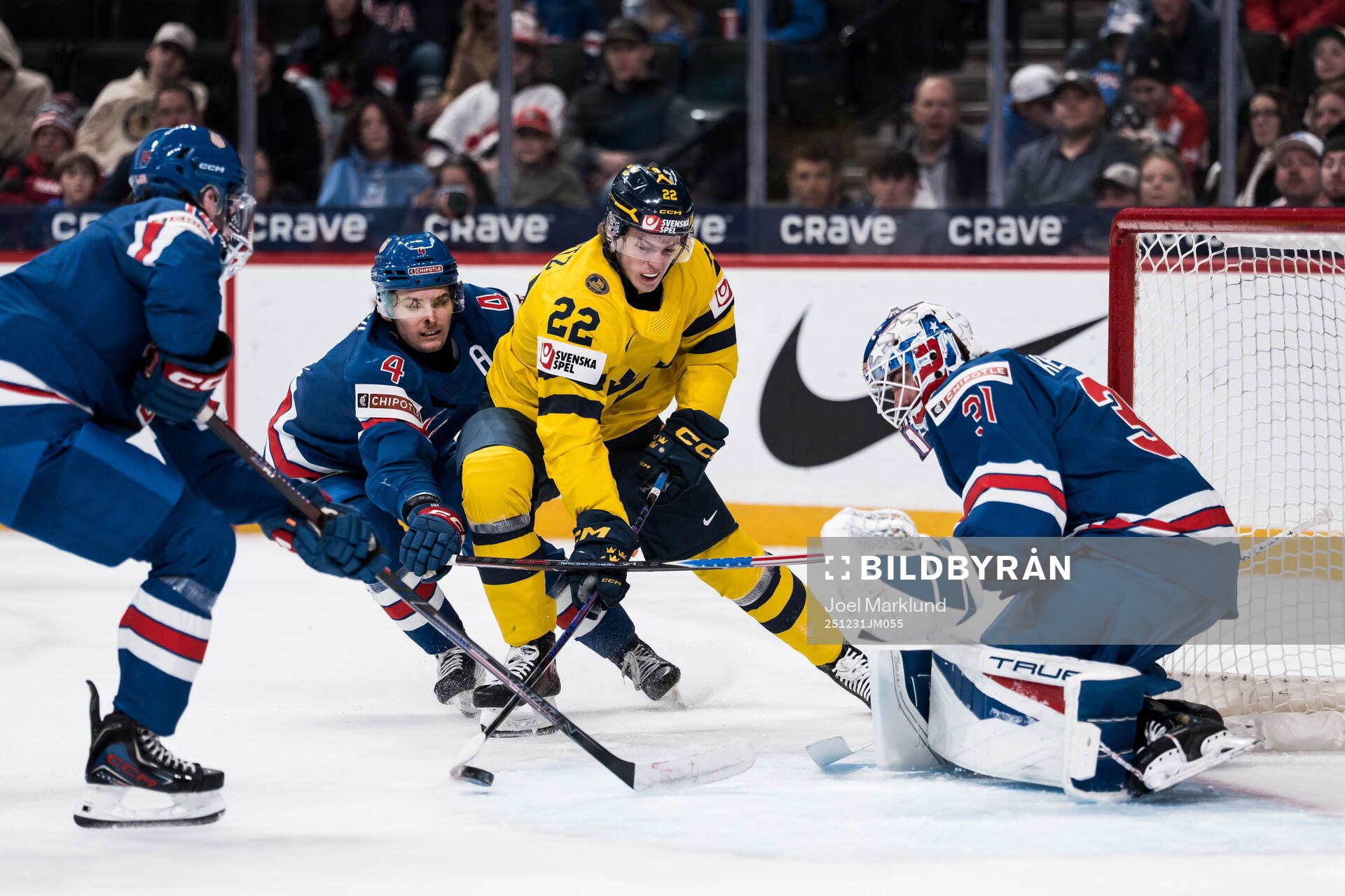 Teddy Stiga of USA and Loke Krantz of Sweden and goaltender