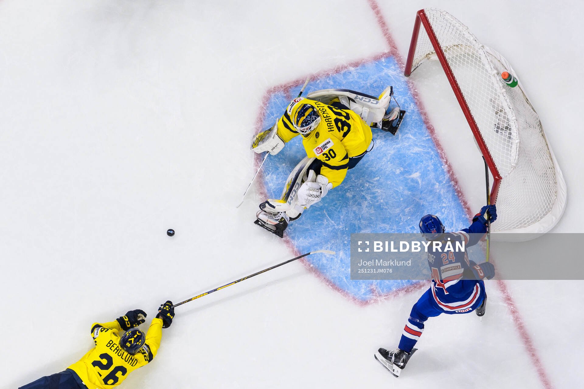 Jack Berglund and goaltender Love Härenstam of Sweden are