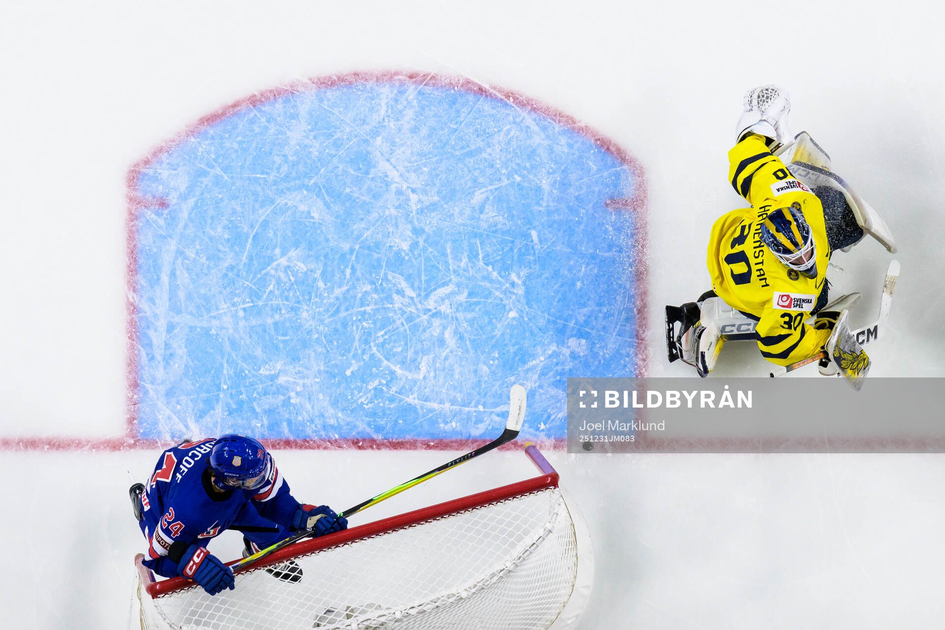 Will Horcoff of USA crashes into the net behind goaltender