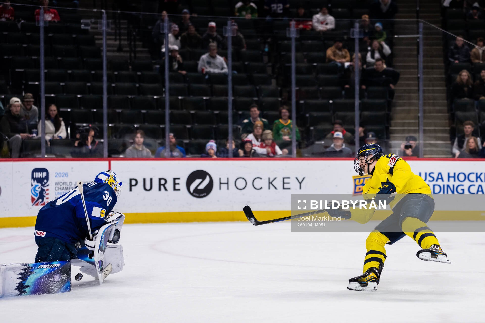 Goaltender Petteri Rimpinen of Finland saves against Viggo