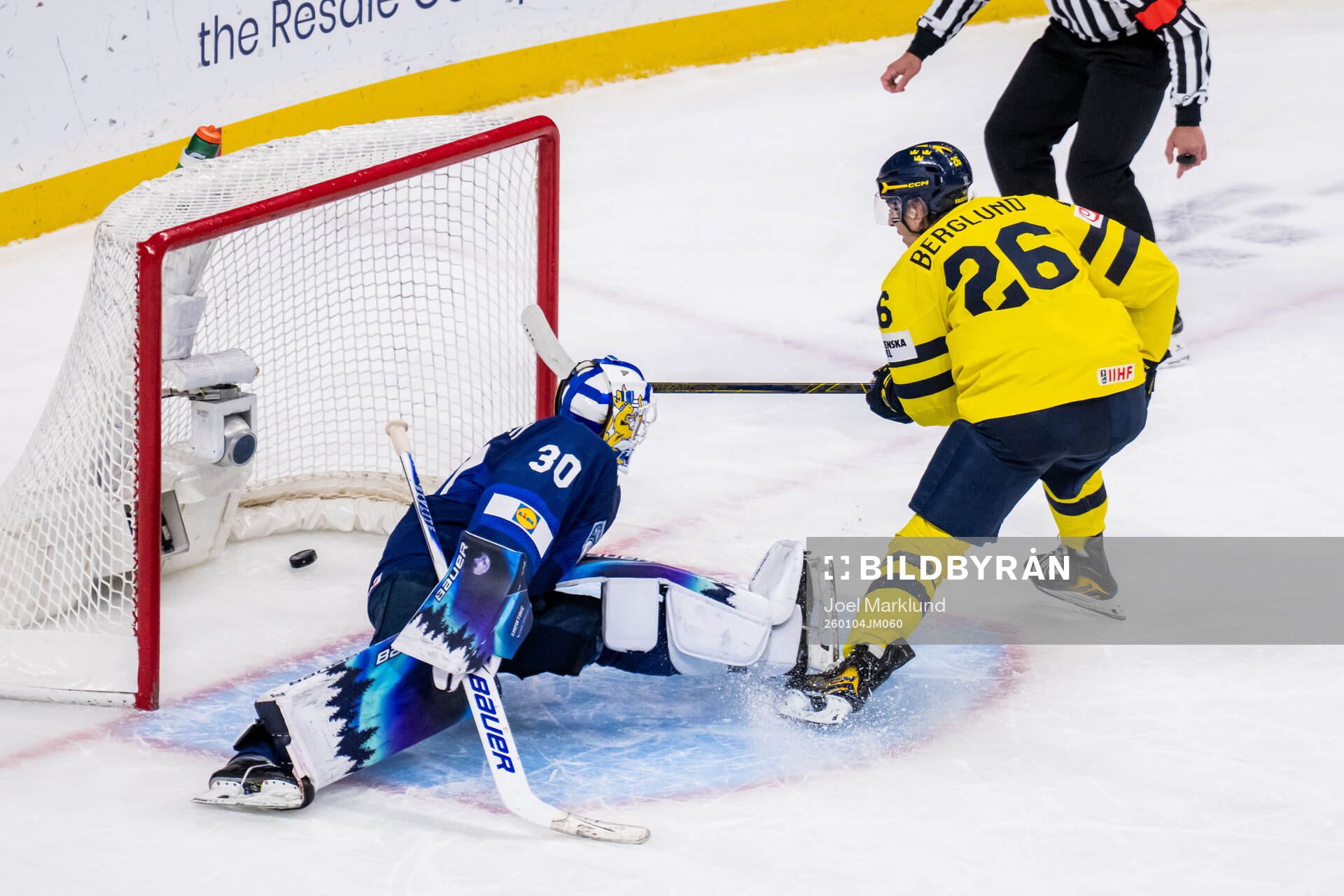 Jack Berglund of Sweden scores against goaltender Petteri