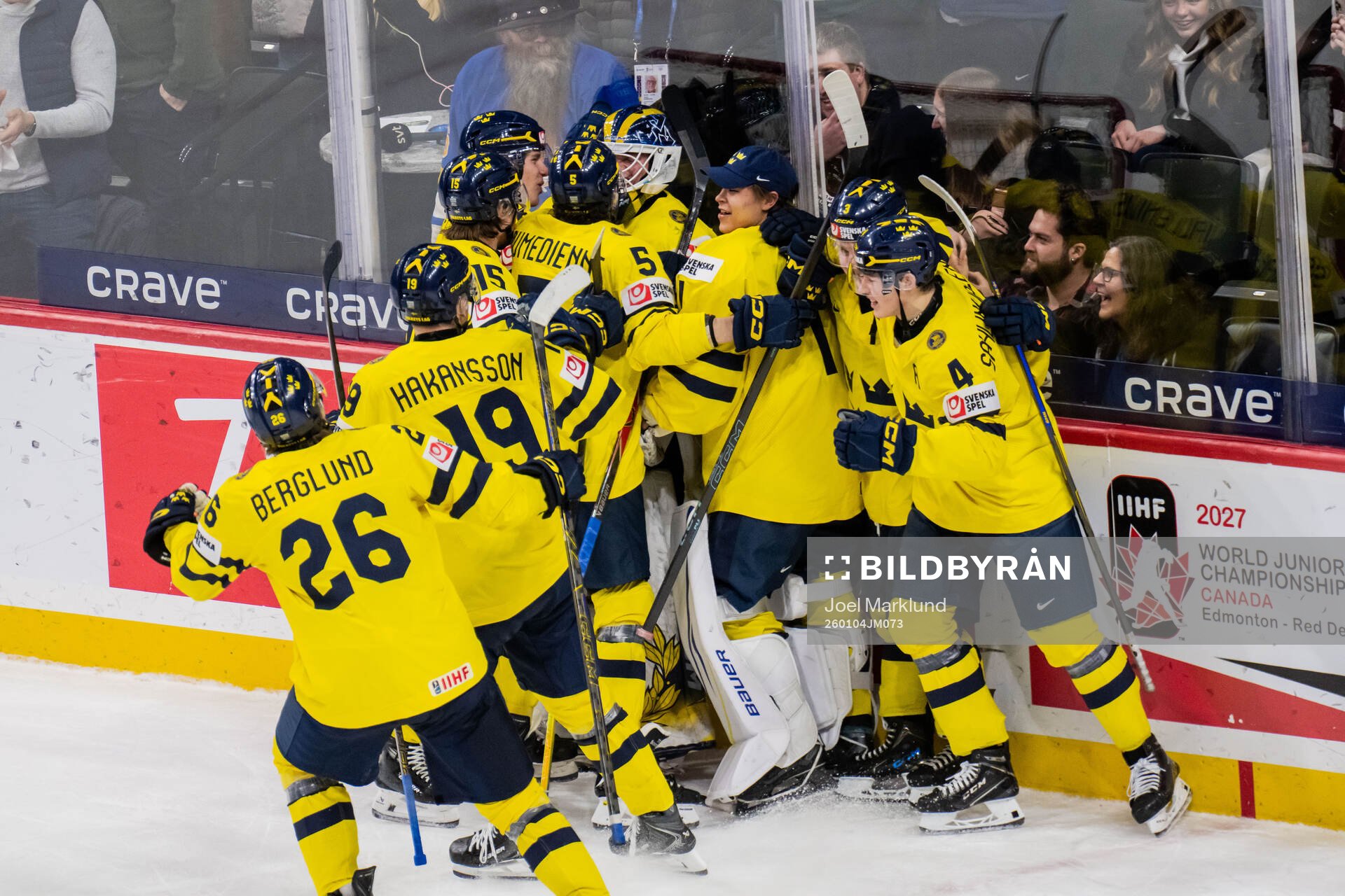Players of Sweden celebrate with goaltender Love Härenstam