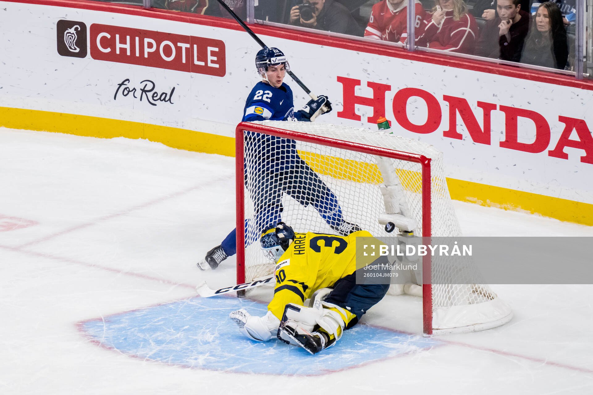 Emil Hemming of Finland and goaltender Love Härenstam of
