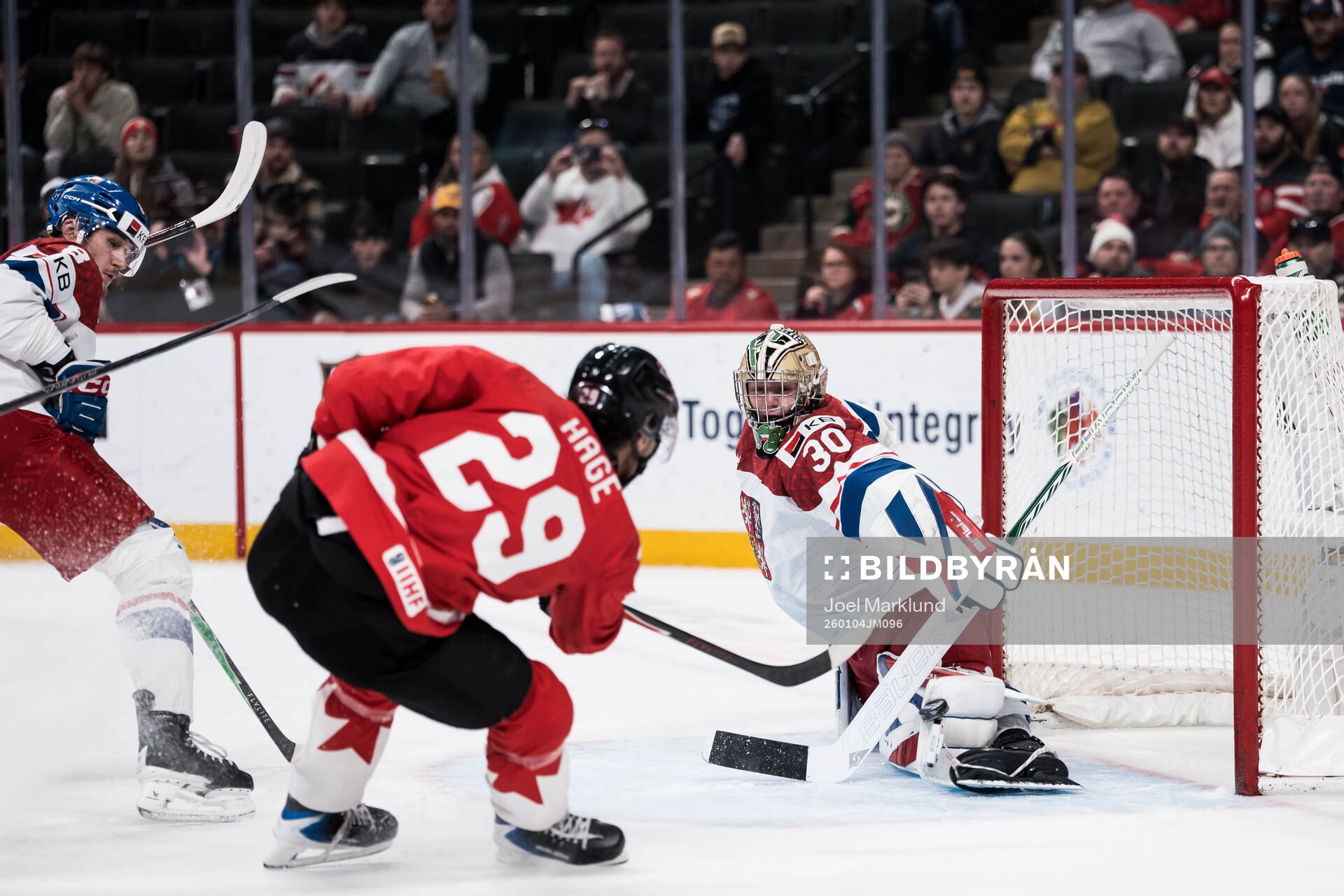 Michael Hage of Canada and goaltender Michal Orsulak of