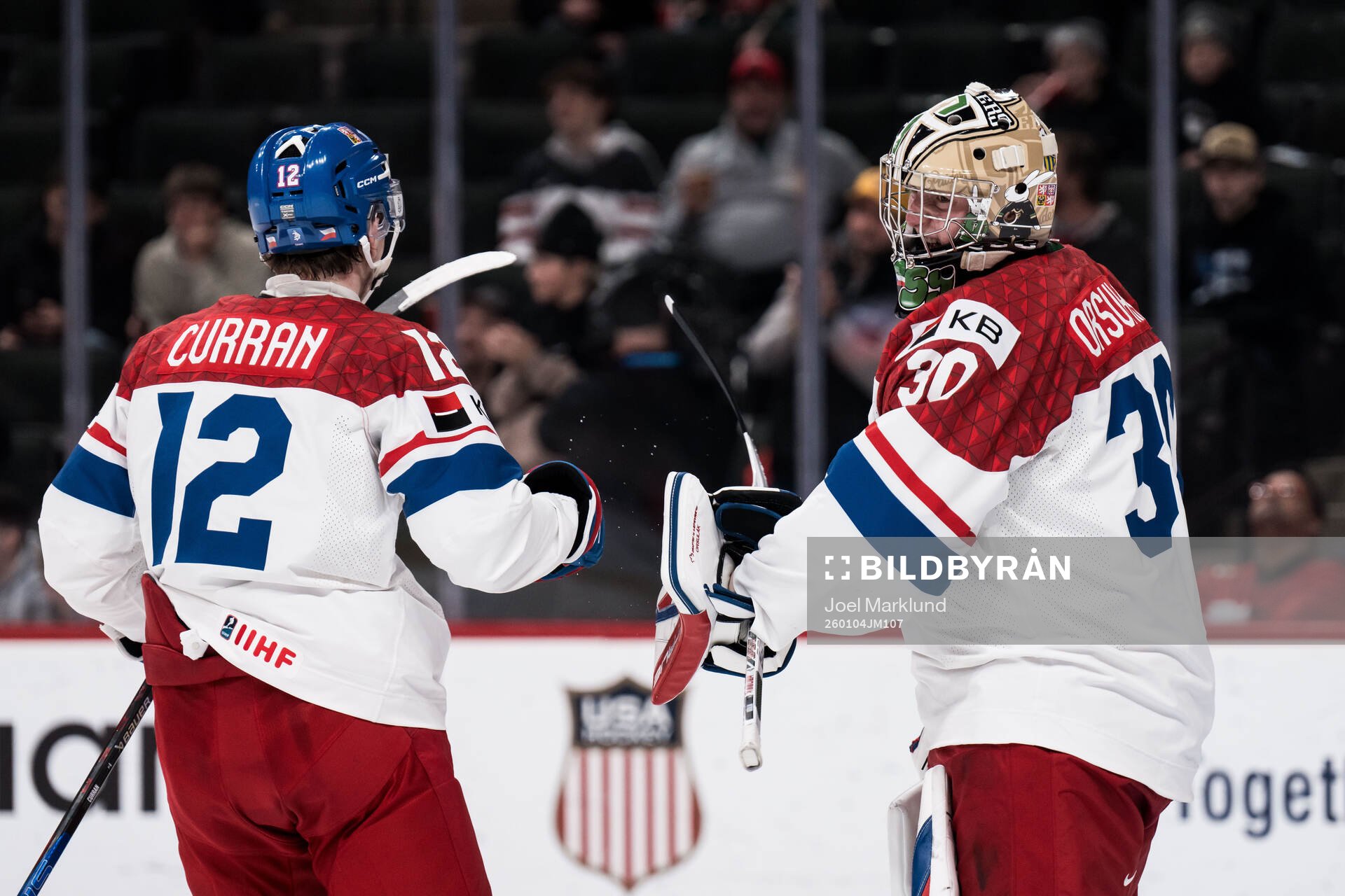 Maxmilian Curran and goaltender Michal Orsulak of Czech