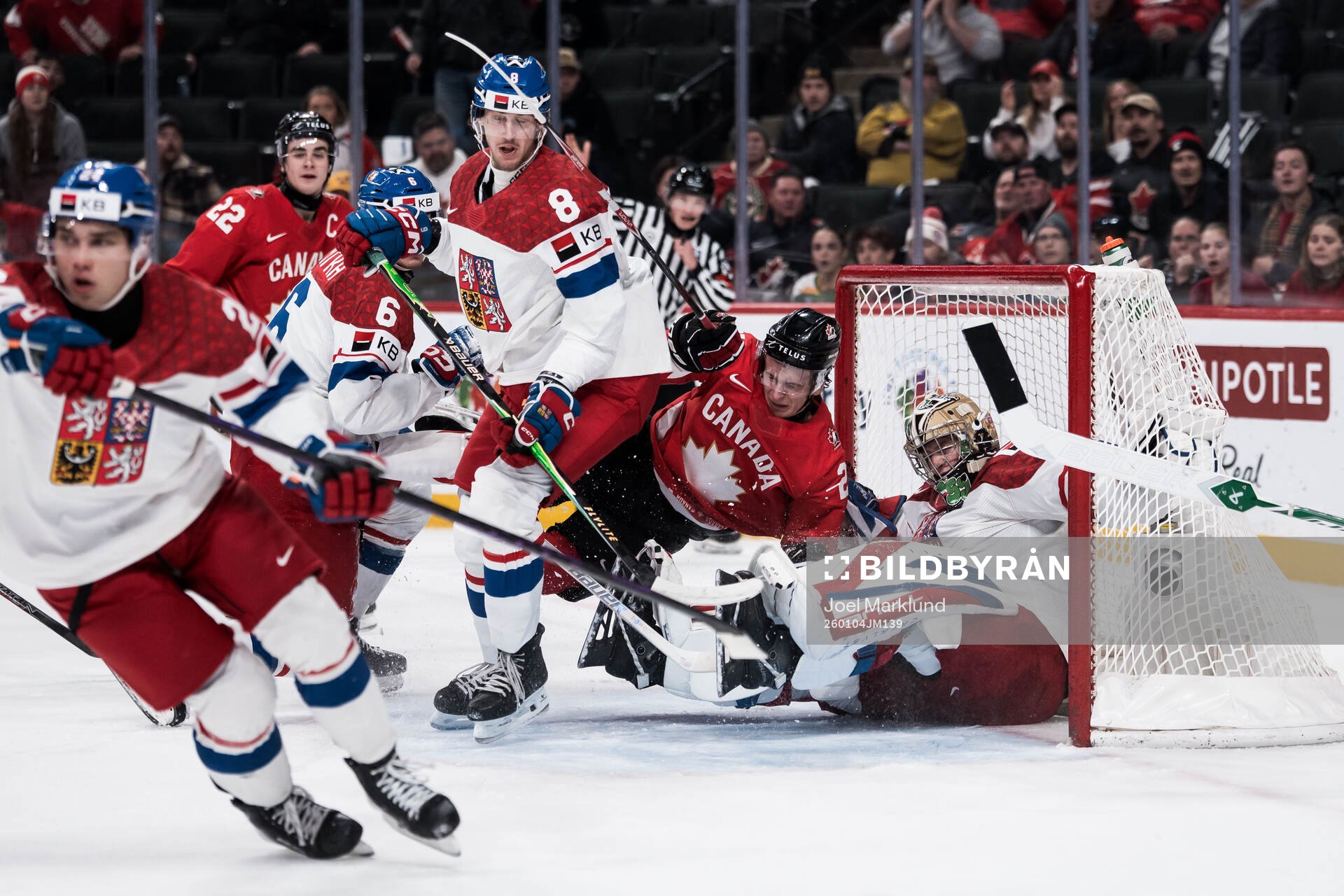 Cole Reschny of Canada and goaltender Michal Orsulak of