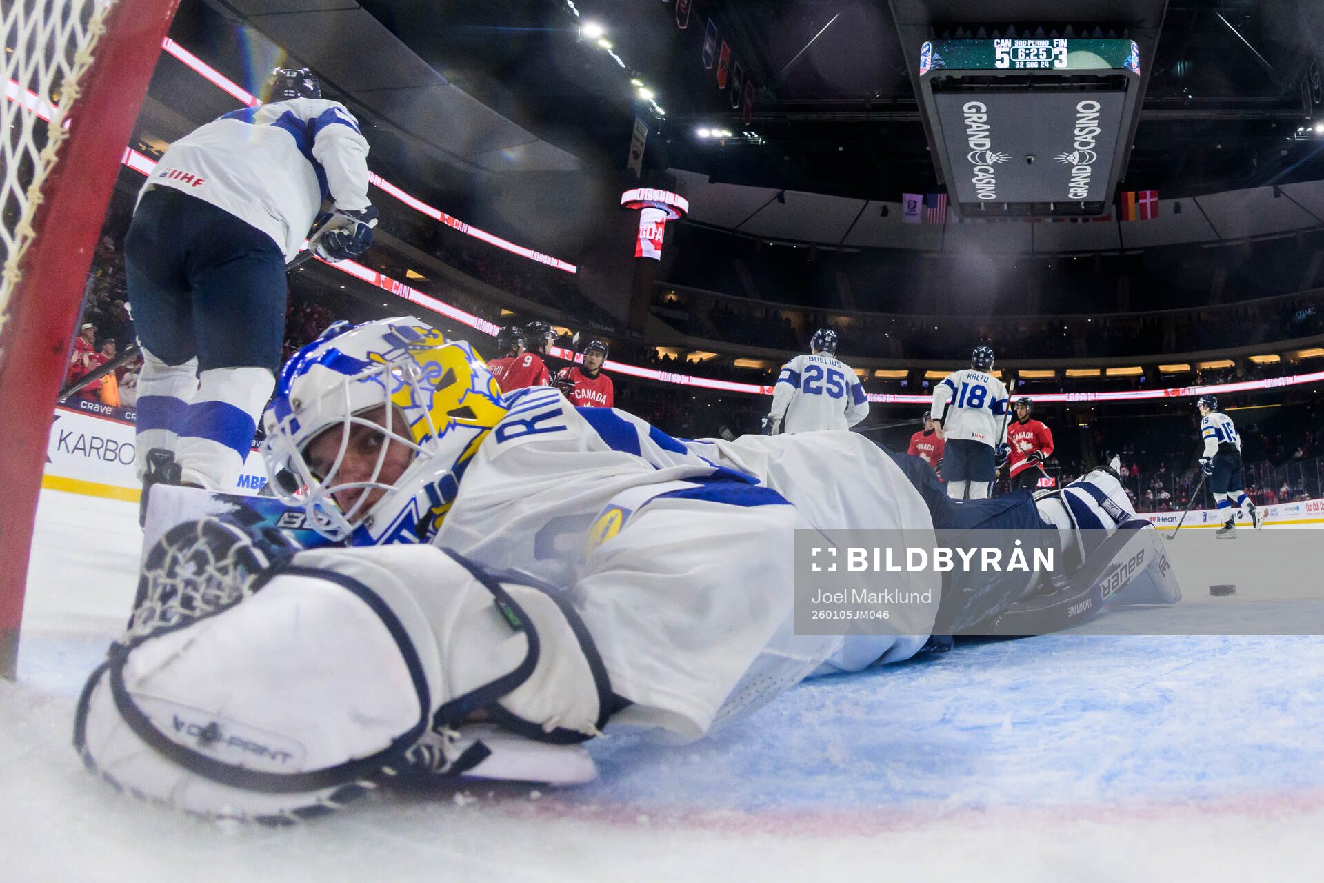 Goaltender Petteri Rimpinen of Finland looks dejected