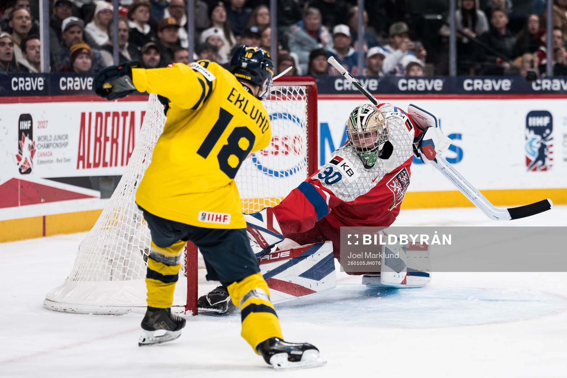 Victor Eklund of Sweden scores the 2-0 goal behind
