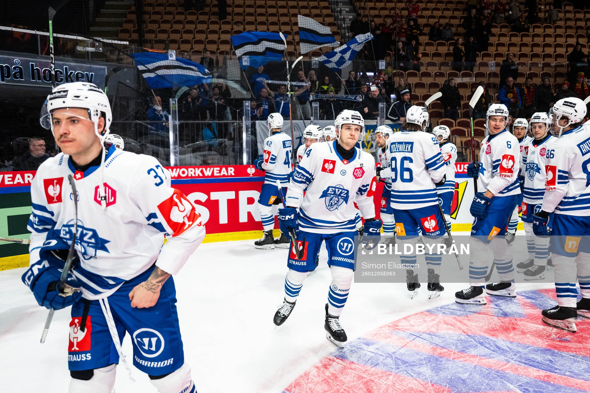 Livio Stadler of EV Zug and team mates looks dejected