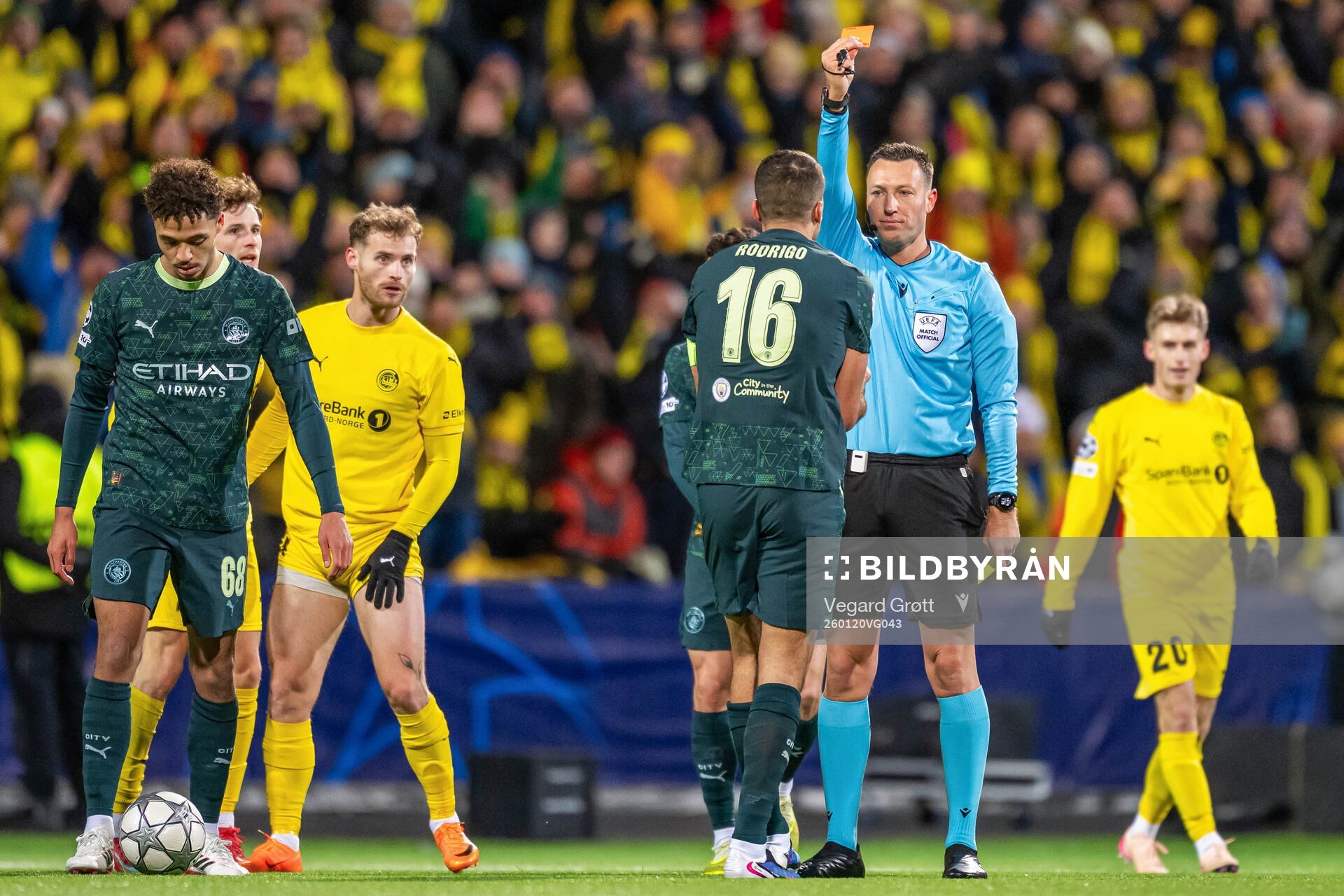 Rodri of Manchester City receives a red card from referee
