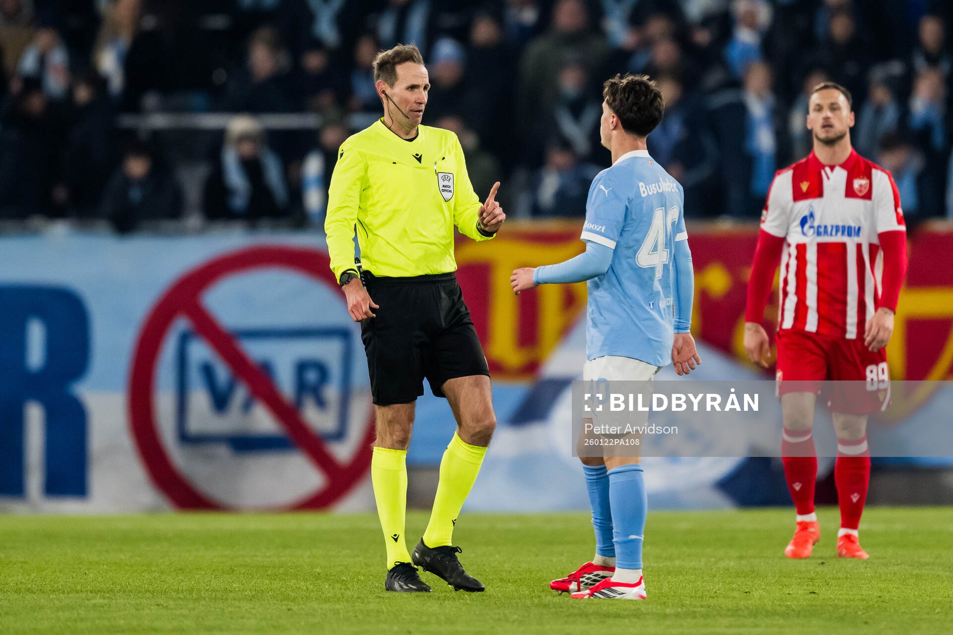 Referee Sascha Stegemann and Kenan Busuladzic of Malmö FF
