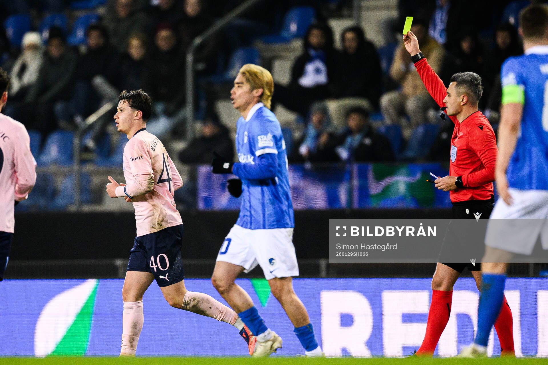 Kenan Busuladzic of Malmö FF receives a yellow card from