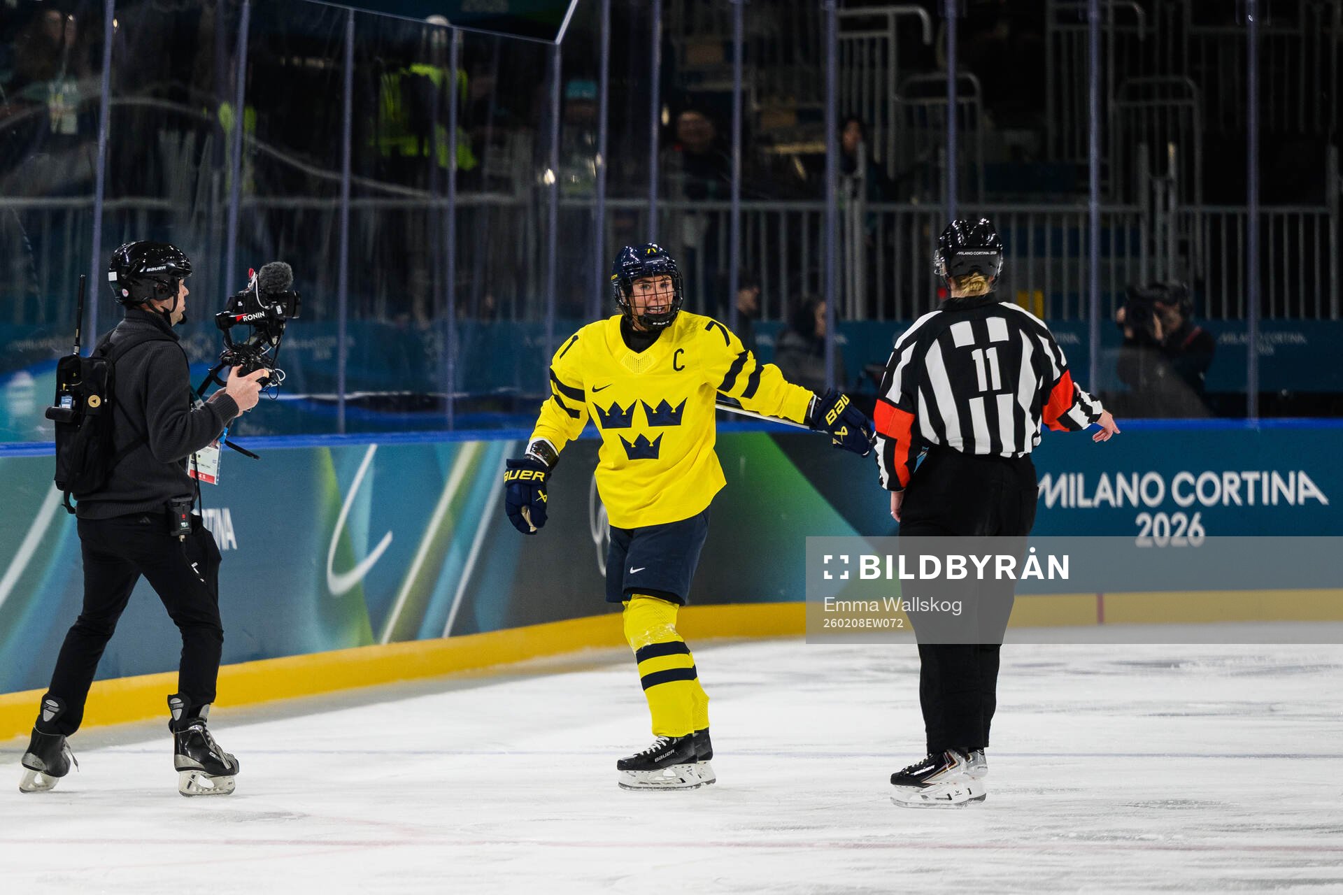 Anna Kjellbin of Sweden reacts in the women's ice hockey