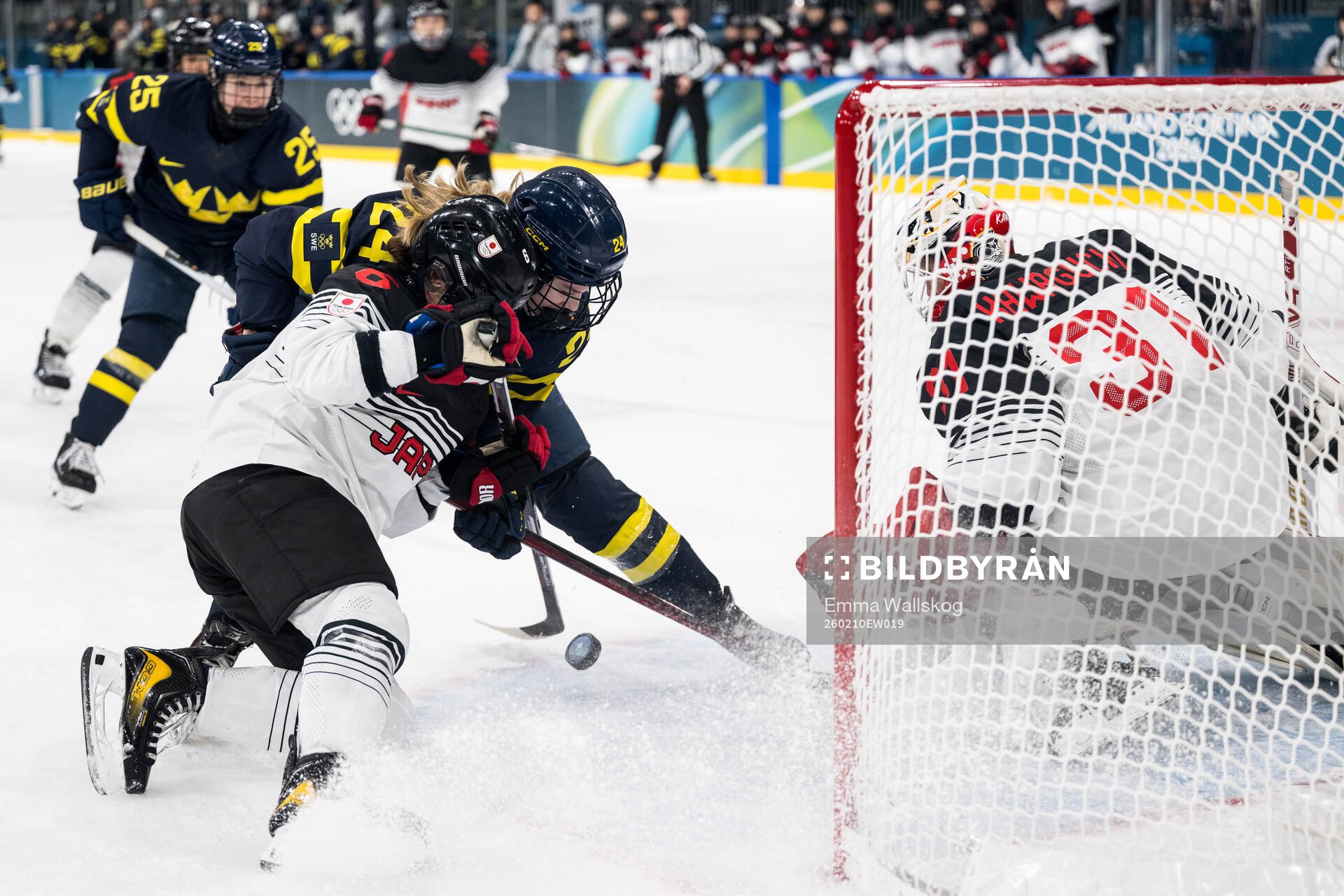 Kohane Sato and goaltender Riko Kawaguchi of Japan and Ebba