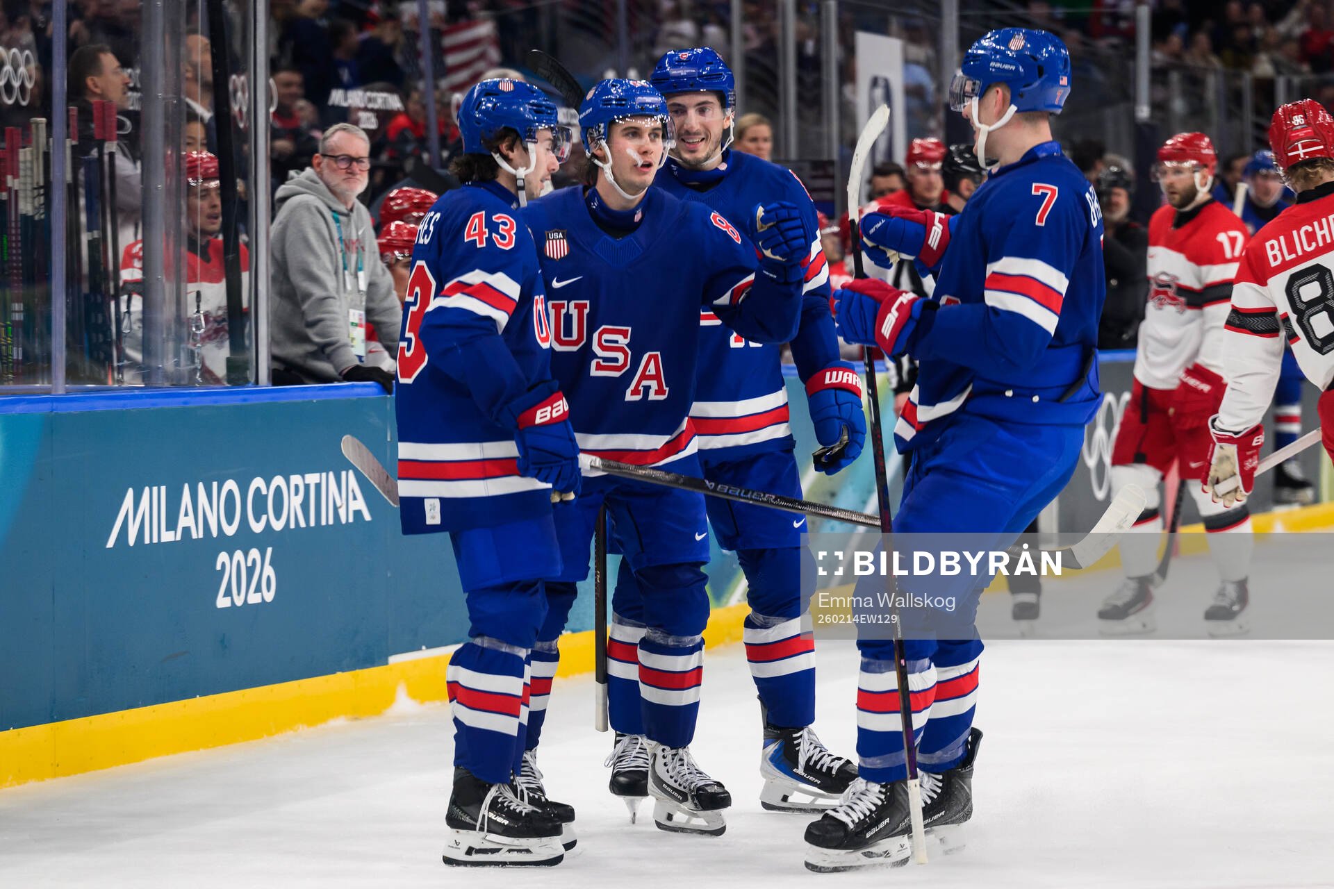 Jack Hughes celebrate with Quinn Hughes and Brady Tkachuk
