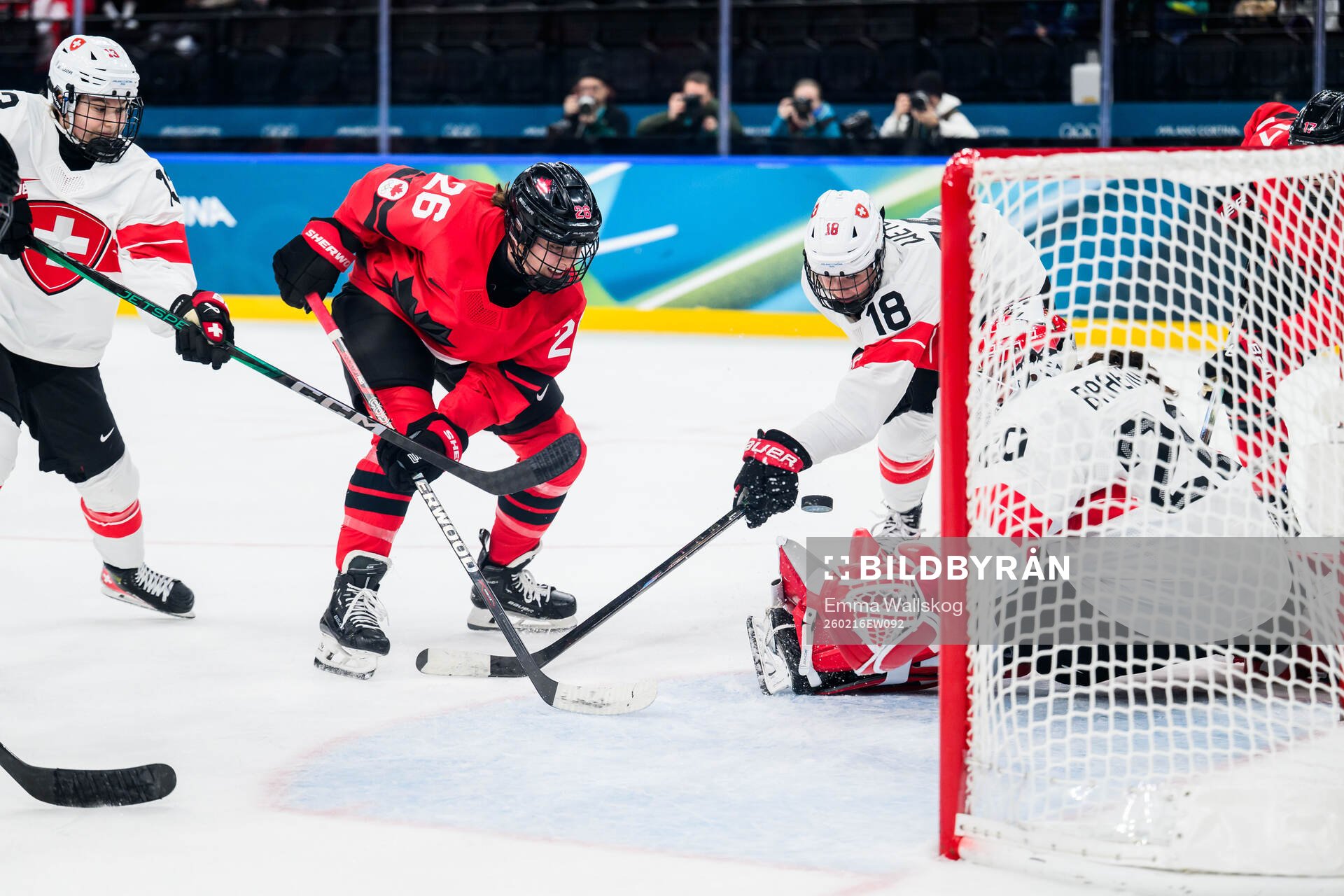 Emily Clark of Canada against Ivana Wey, Stefanie Wetli and
