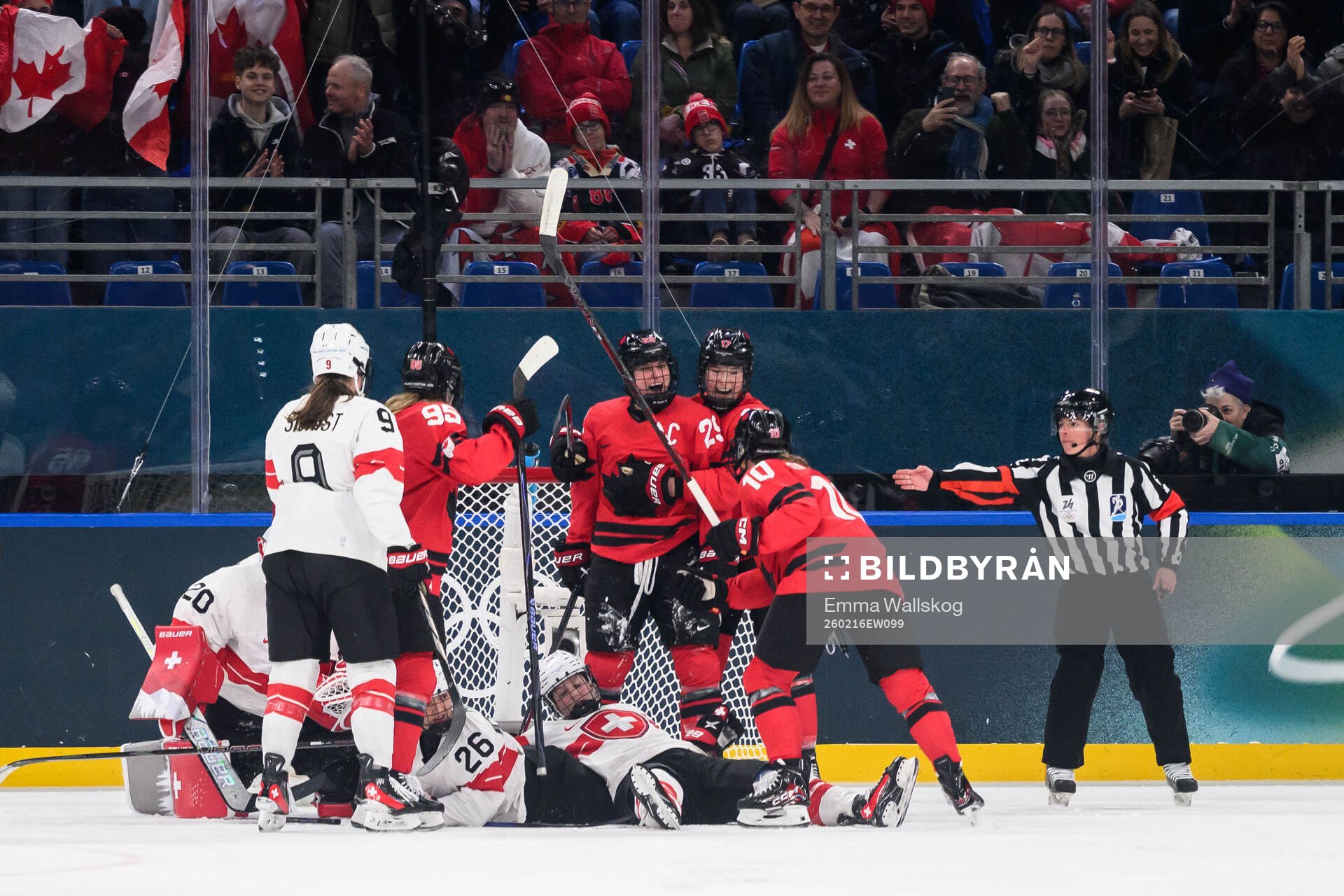Marie-Philip Poulin of Canada celebrate with Daryl Watts,
