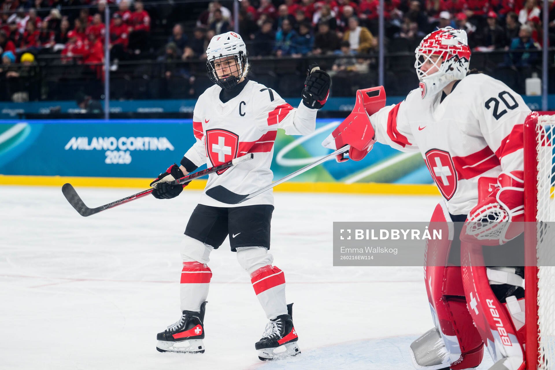Lara Stalder and goaltender Andrea Braendli of Switzerland
