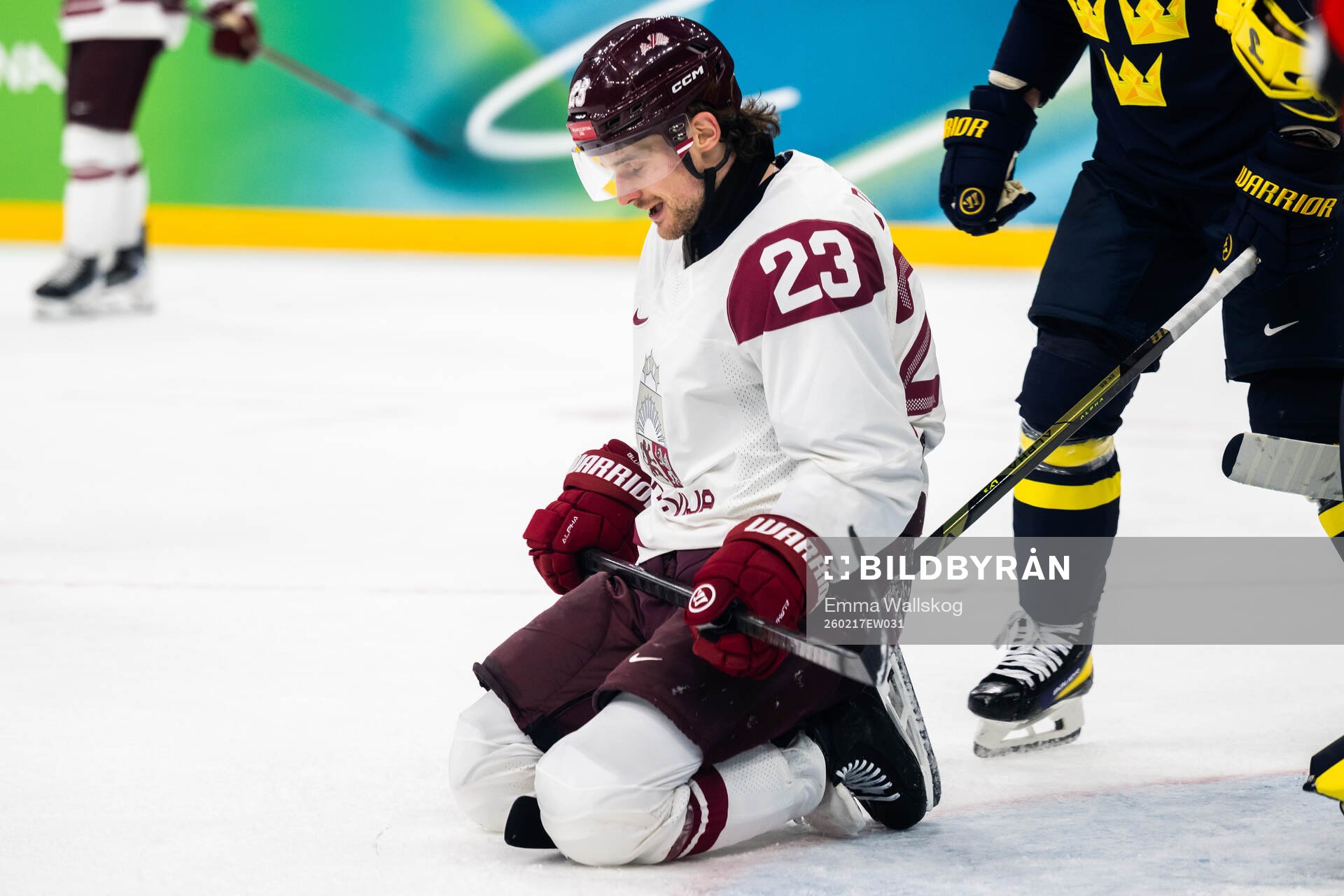 Teodors Blugers of Latvia looks dejected in the men's ice