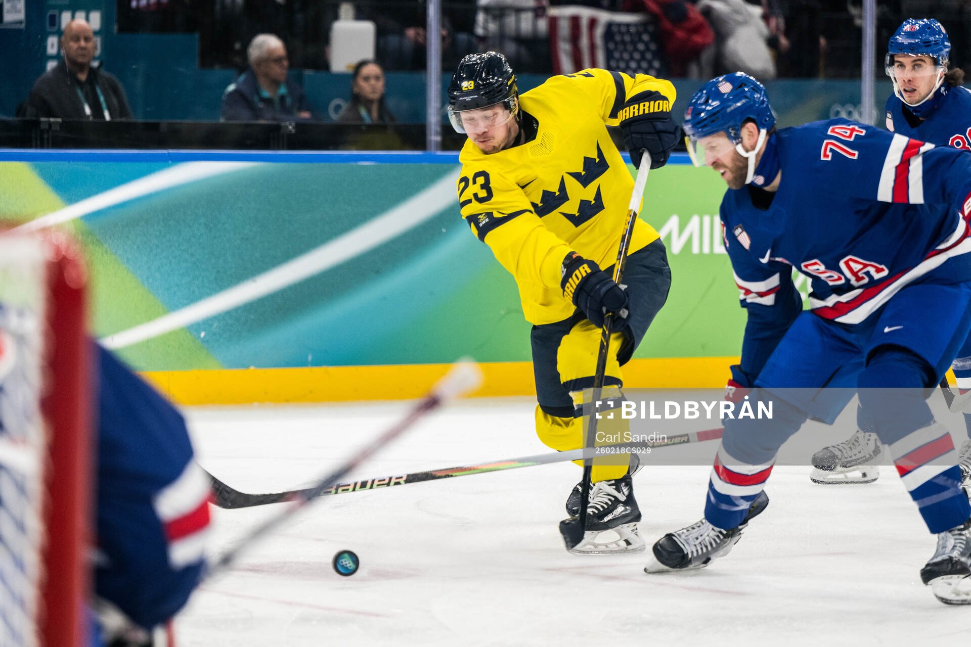 Lucas Raymond of Sweden and Jaccob Slavin of USA in the