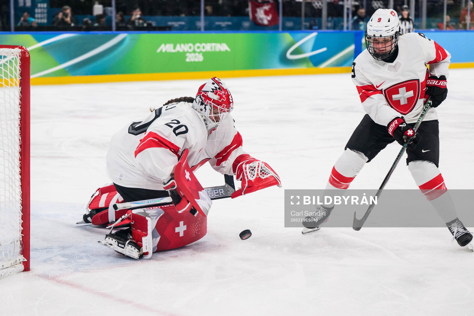 Goaltender Andrea Braendli and Shannon Sigrist of