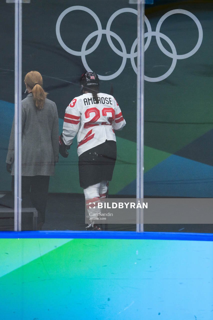 Erin Ambrose of Canada leaves the ice with an injury in the