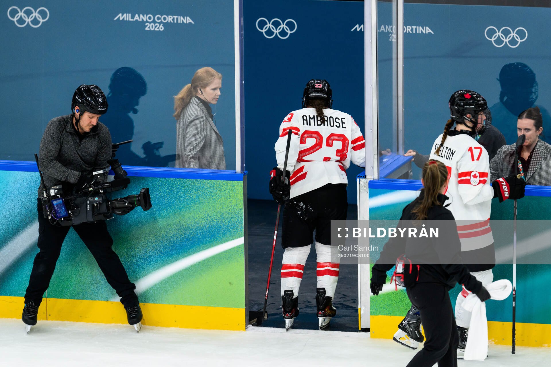 Erin Ambrose of Canada leaves the ice with an injury in the