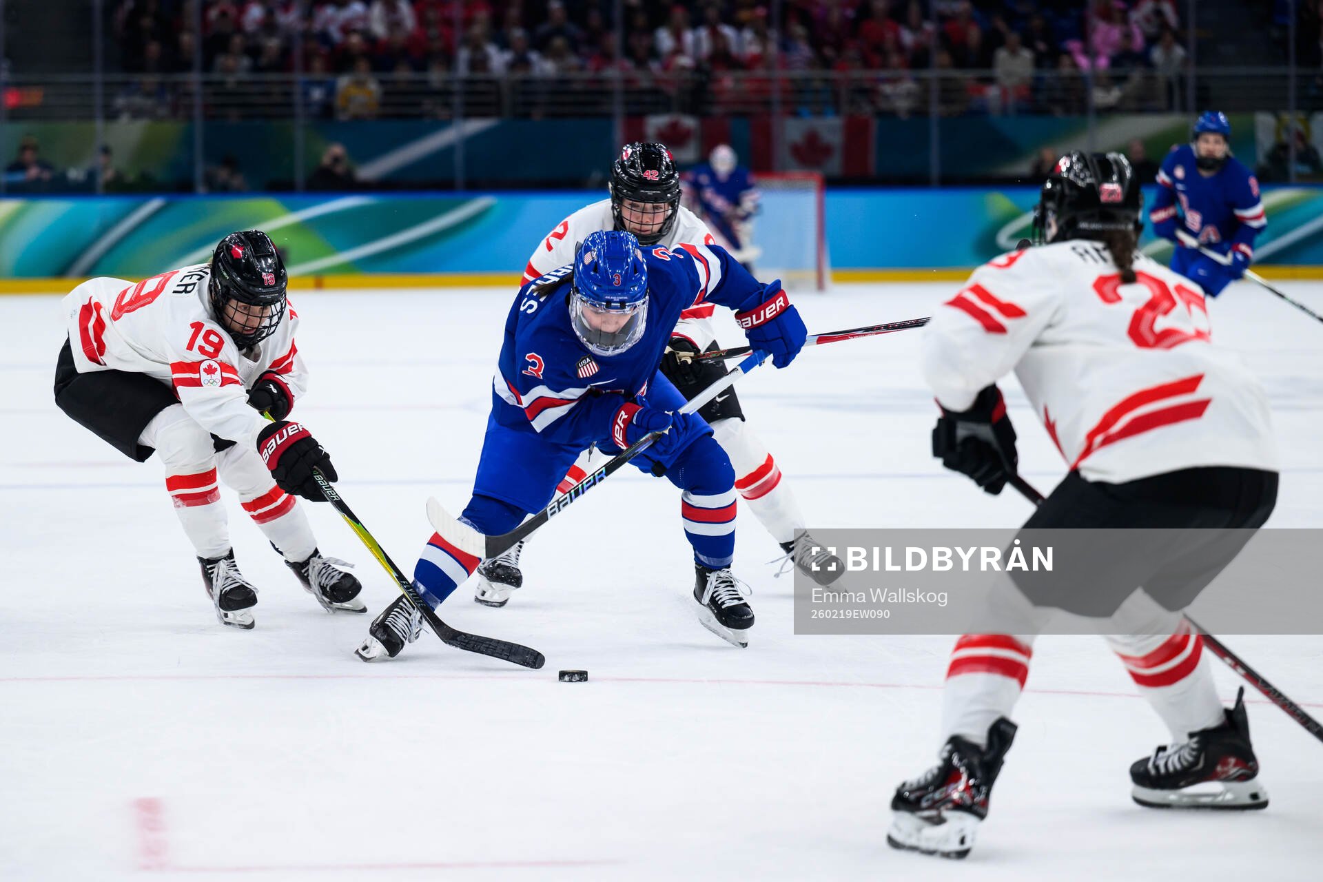 Cayla Barnes of USA against Brianne Jenner, Claire Thompson