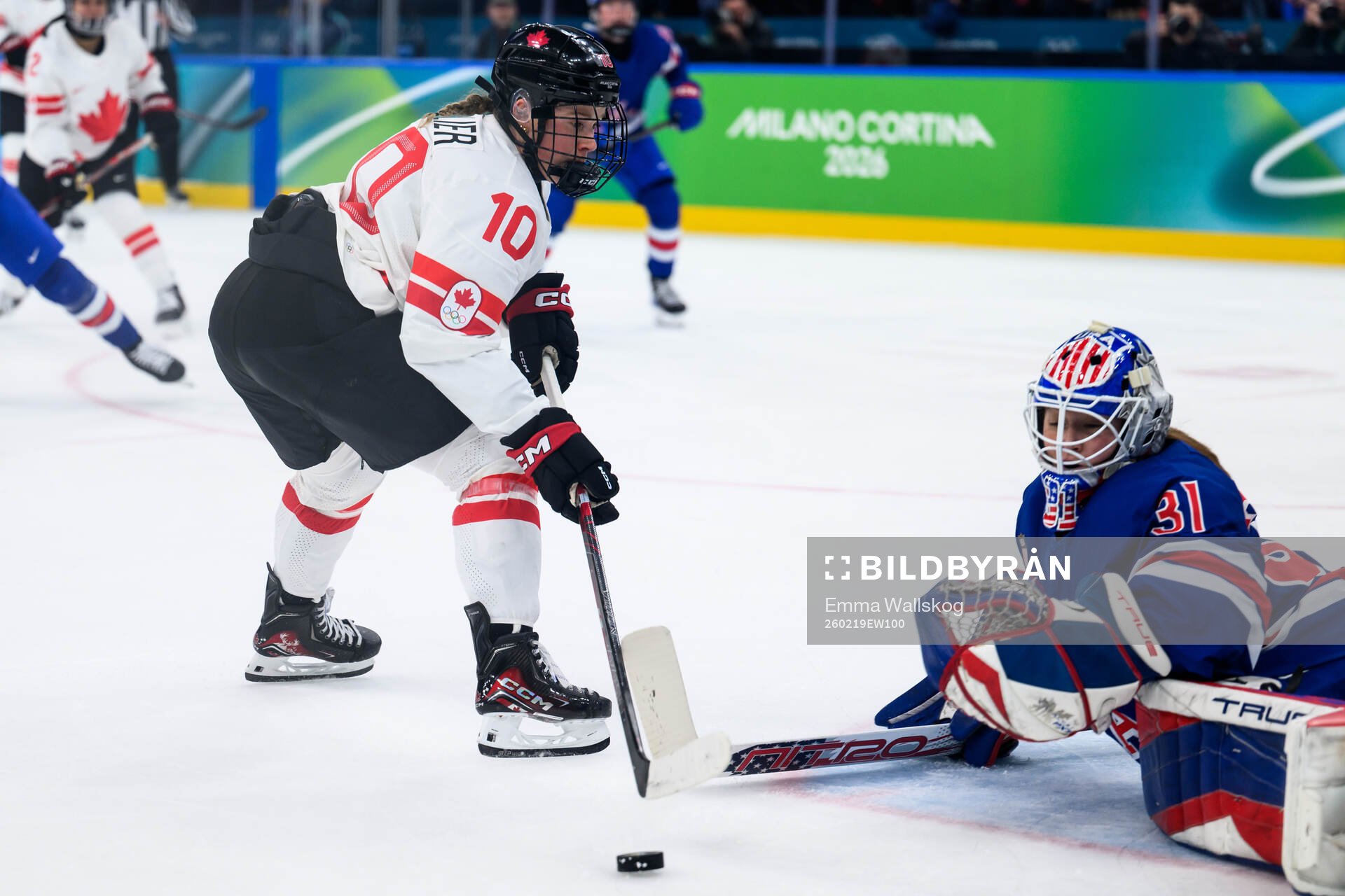 Sarah Fillier of Canada and goaltender Aerin Frankel of USA