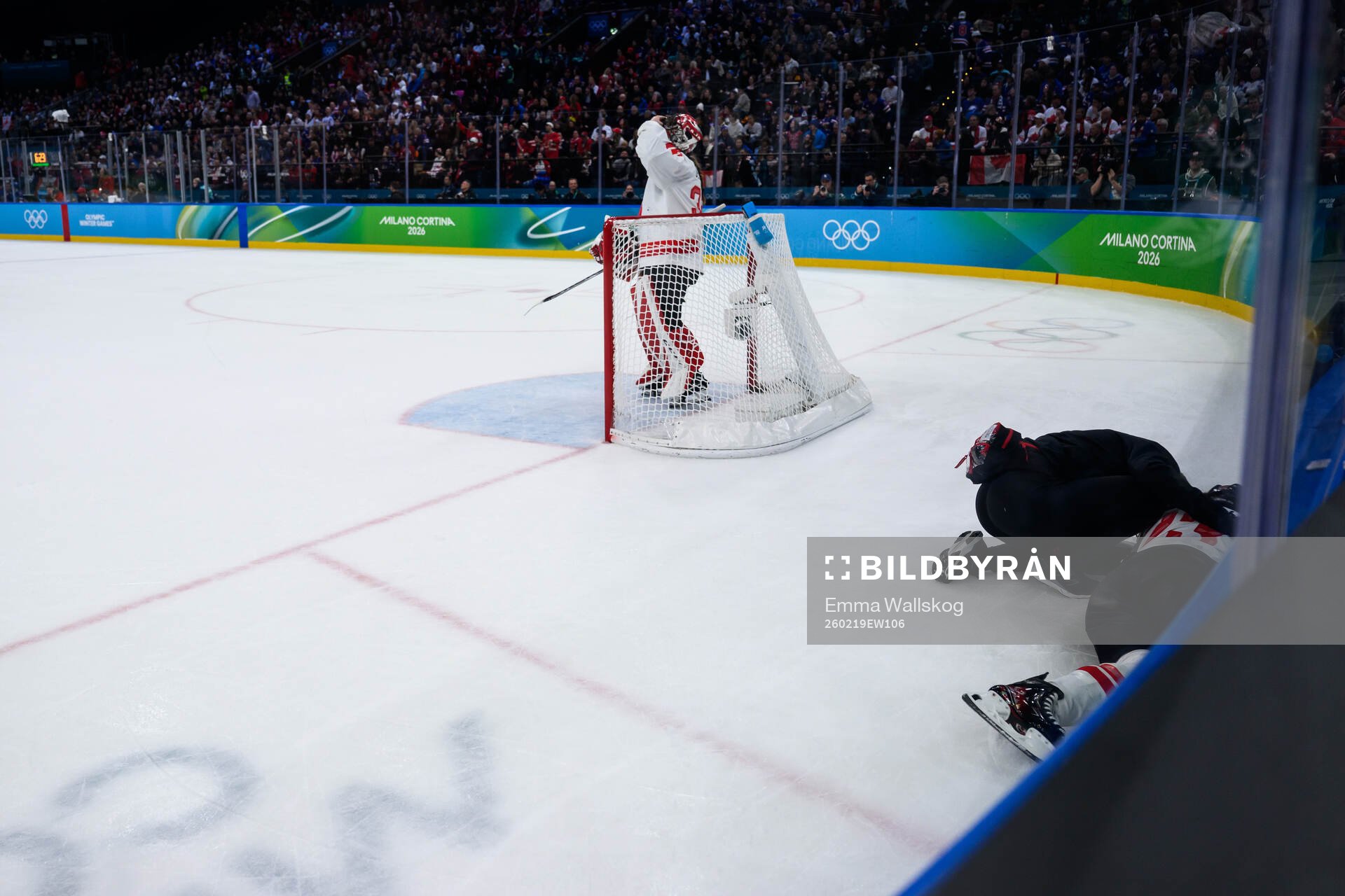 Erin Ambrose of Canada in pain in the women's ice hockey