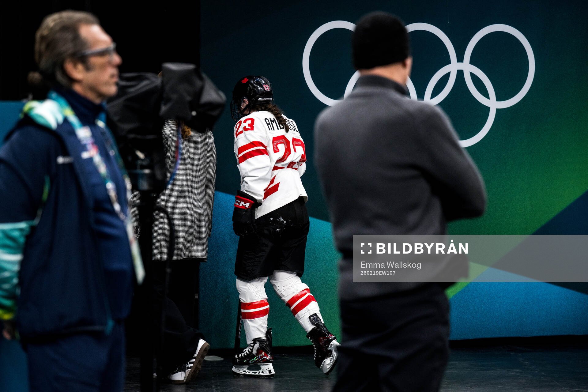 Erin Ambrose of Canada leaves the ice with an injury in the