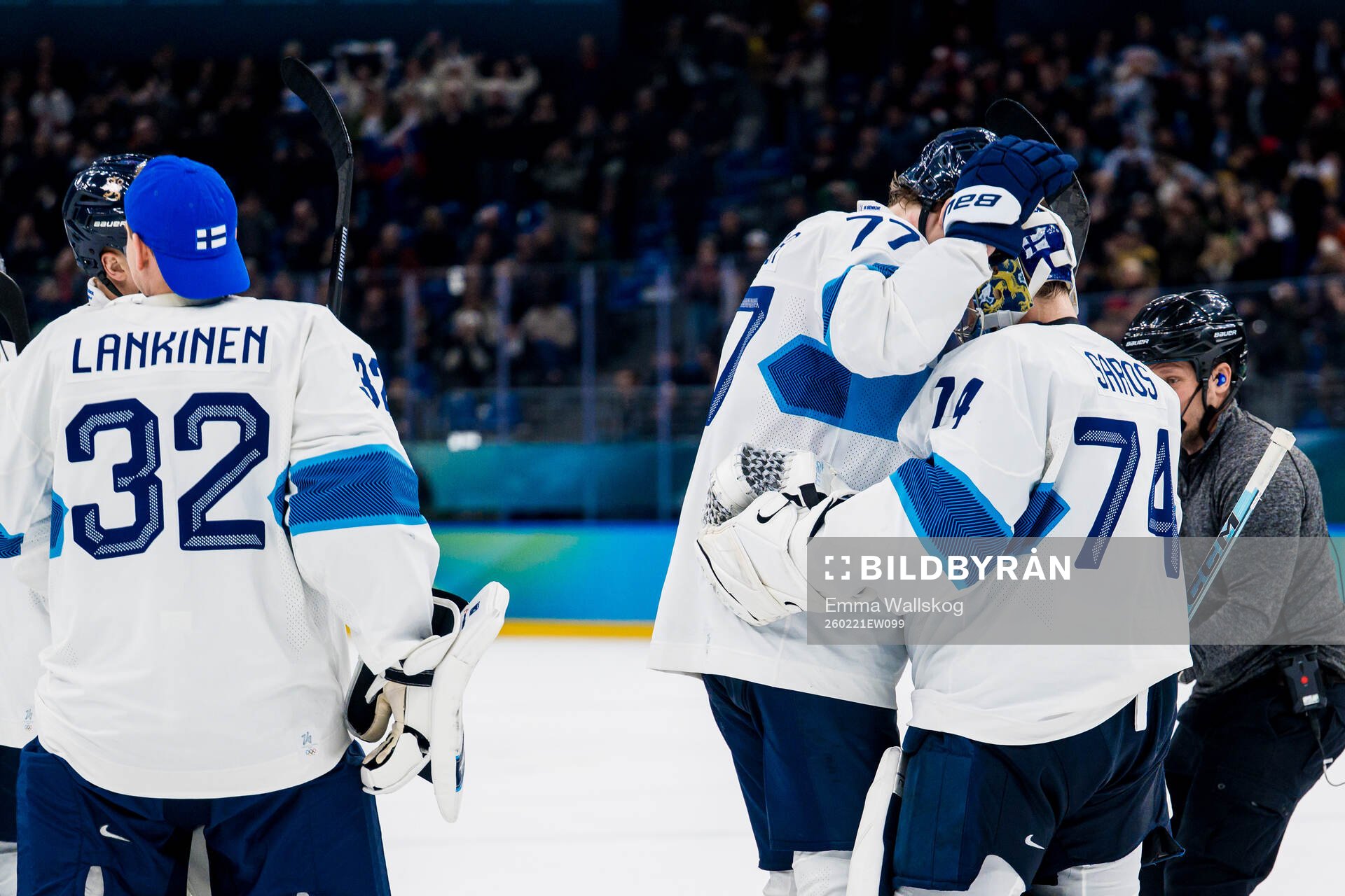 Niko Mikkola and goaltender Juuse Saros of Finland celebrate