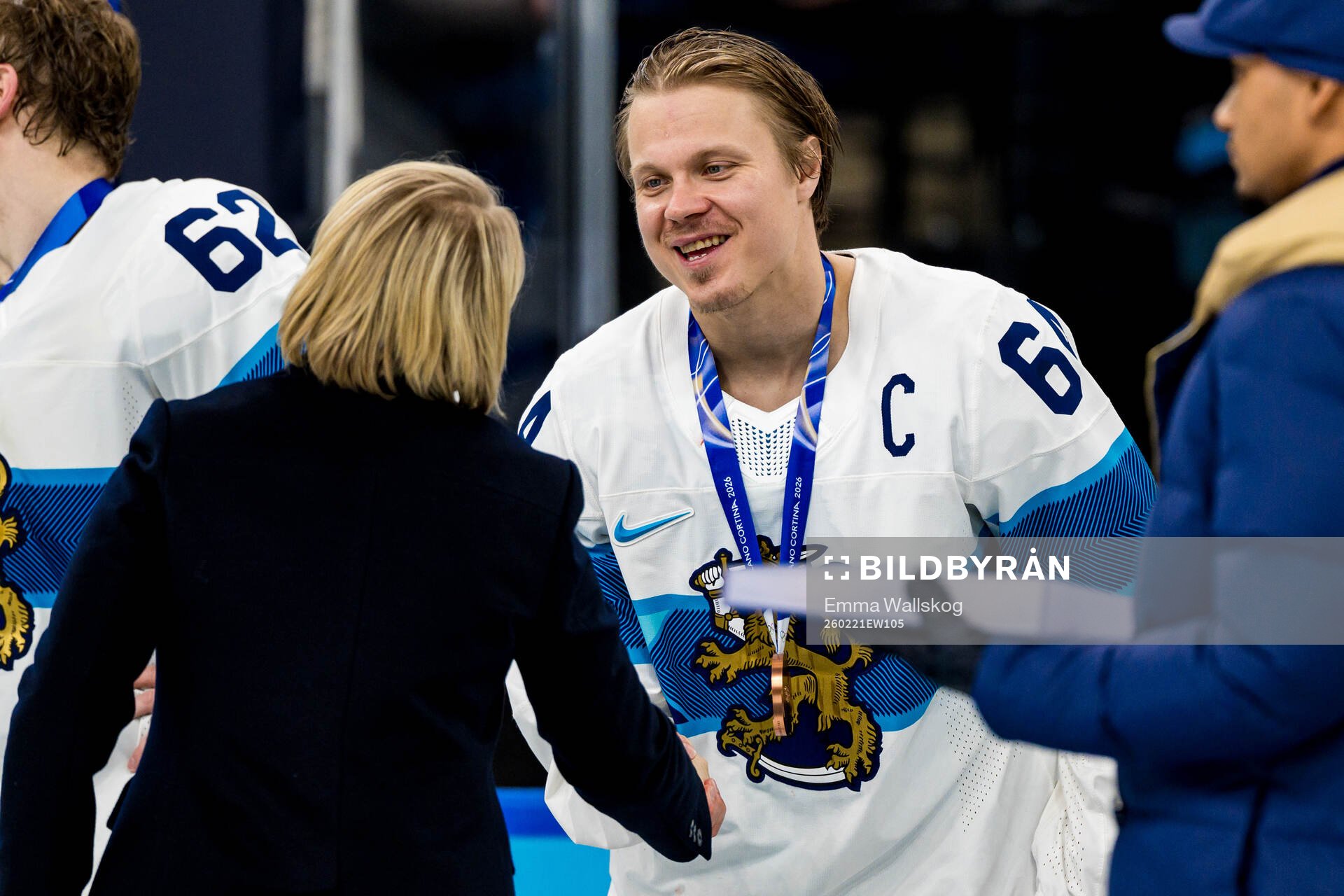 Mikael Granlund of Finland with their bronze medals at the