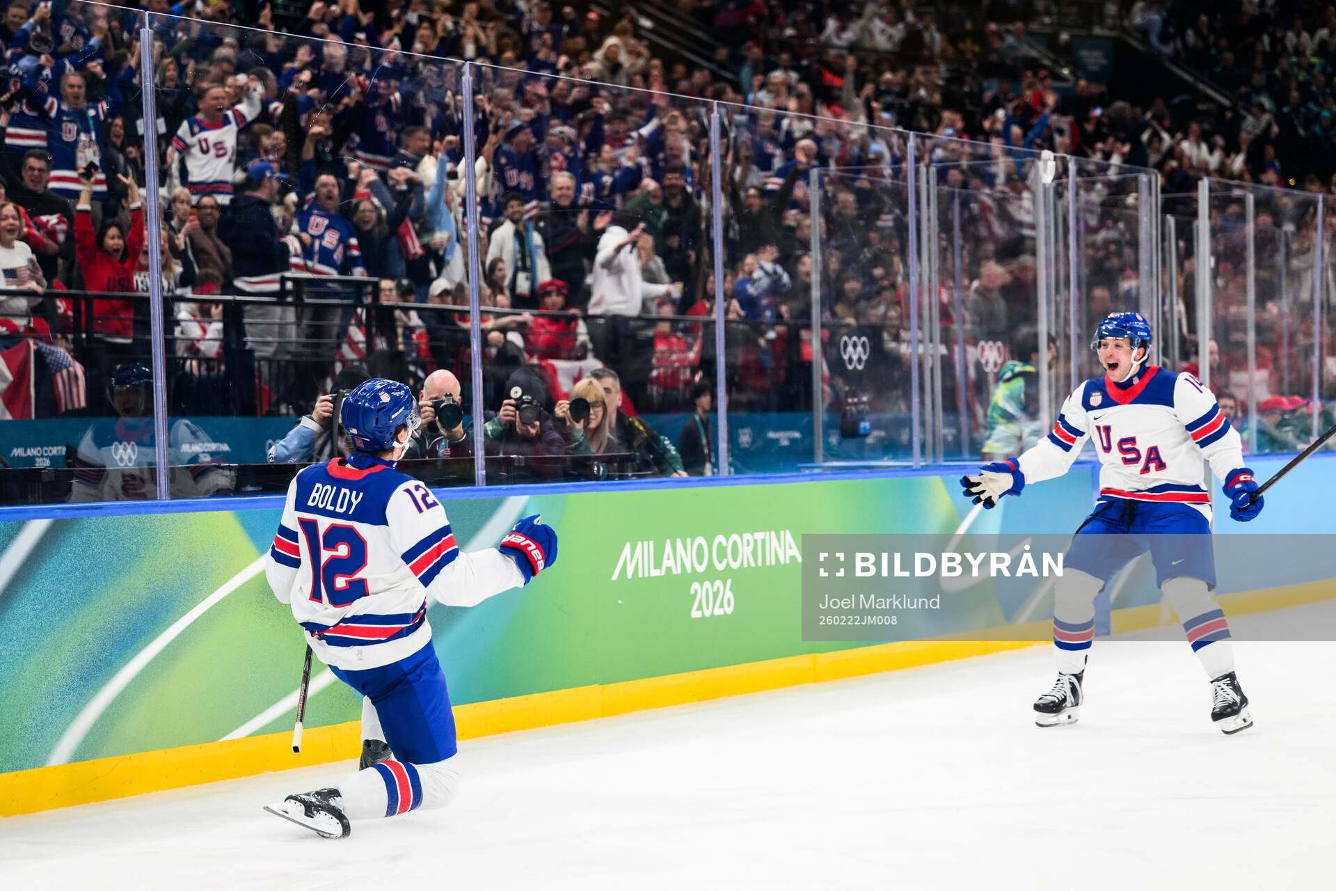 Matt Boldy and Brock Faber of USA celebrate